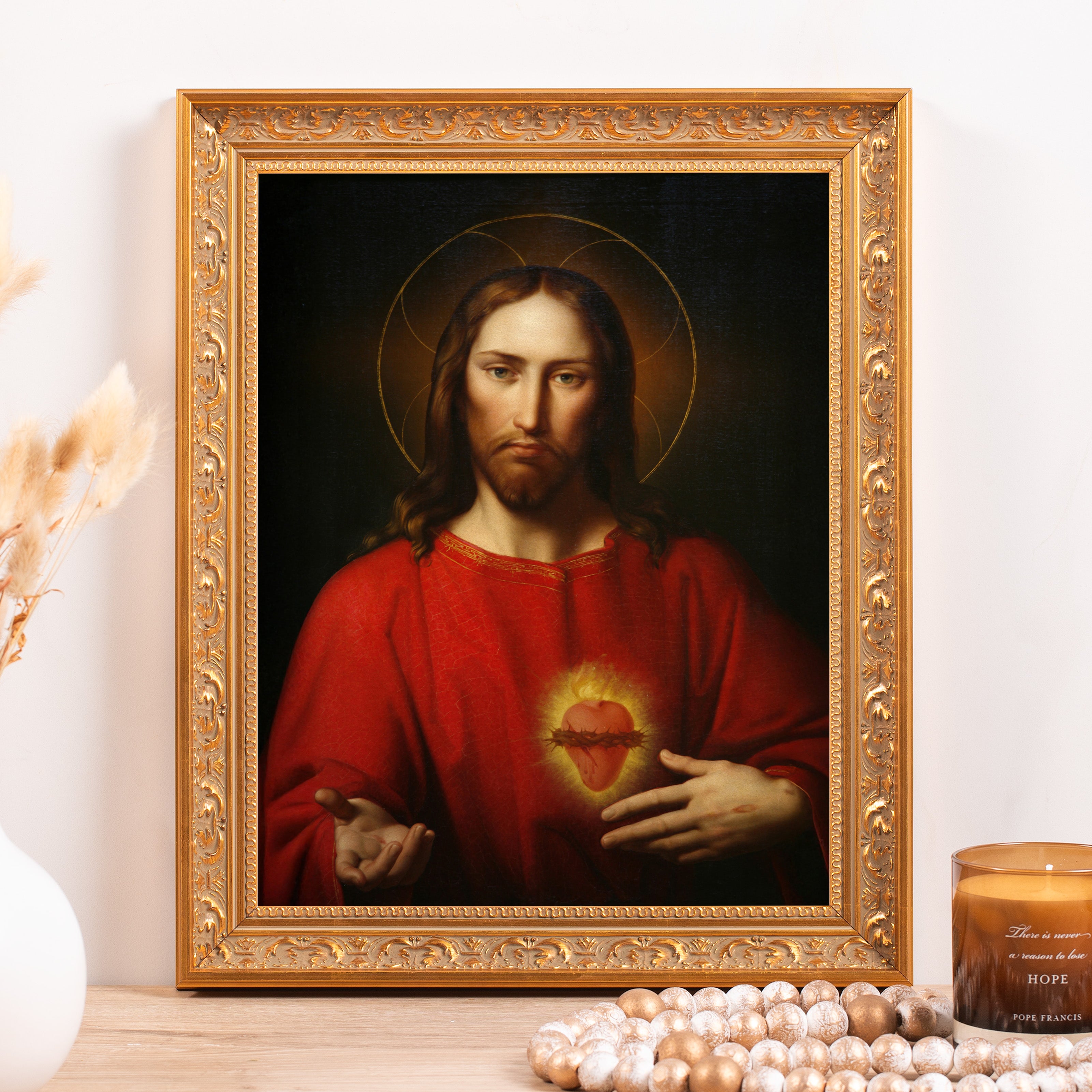 Framed painting of Jesus with a sacred heart, in a gold ornate frame, intended for religious display.