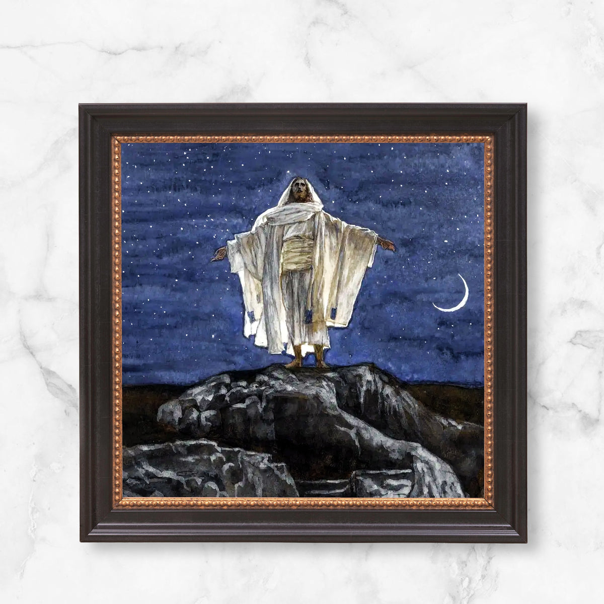 Framed watercolor painting of Jesus standing on a hill beneath a starry night sky and crescent moon.