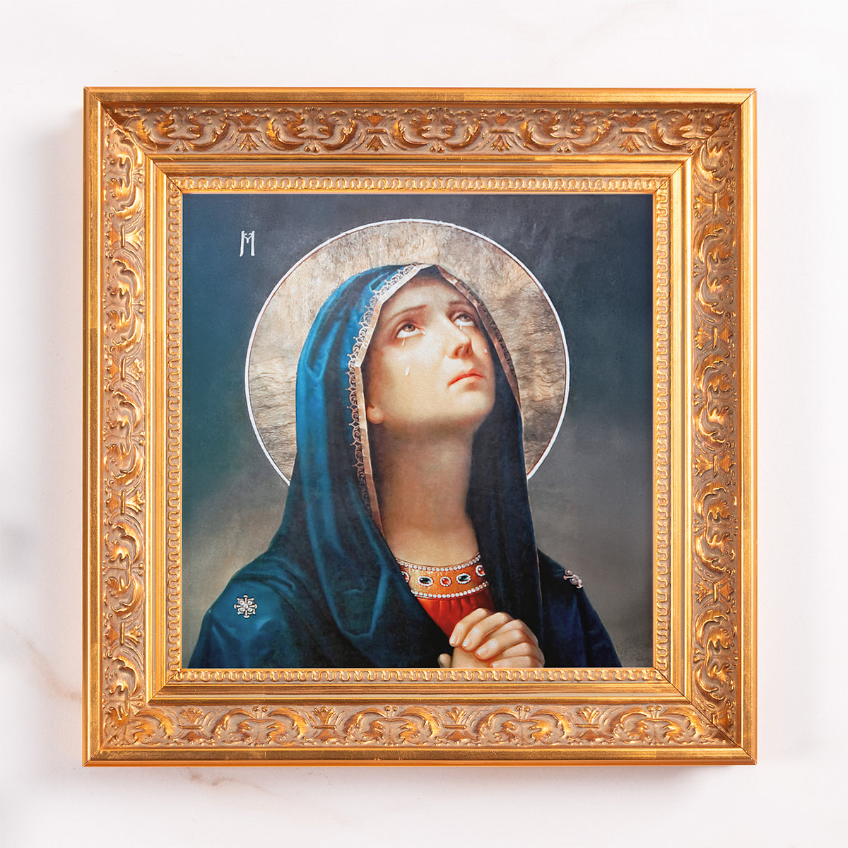 Framed print of Mary, with blue robe and halo, gold ornate frame.