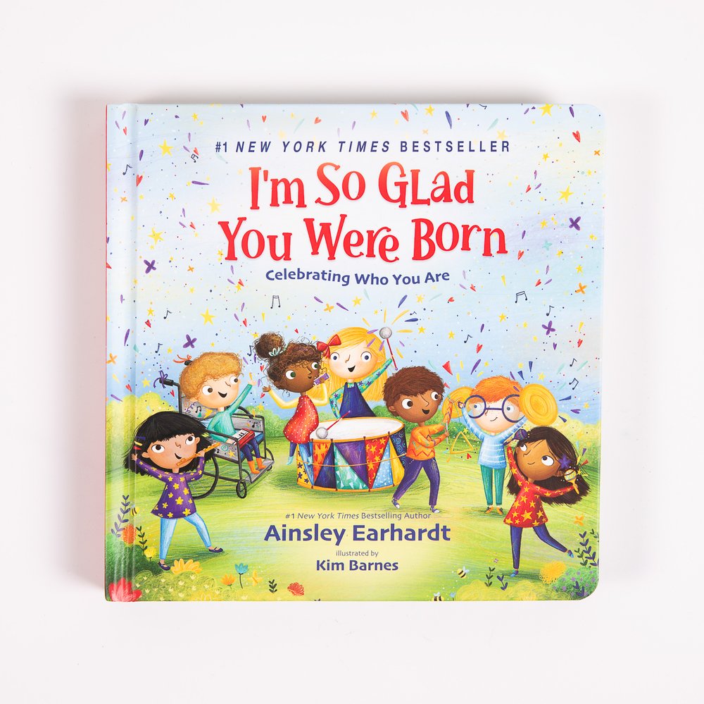 Children's book, "I'm So Glad You Were Born", features diverse kids on cover.