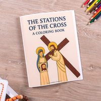 Cover of “The Stations of the Cross” Catholic coloring book with illustrated Jesus carrying the cross.