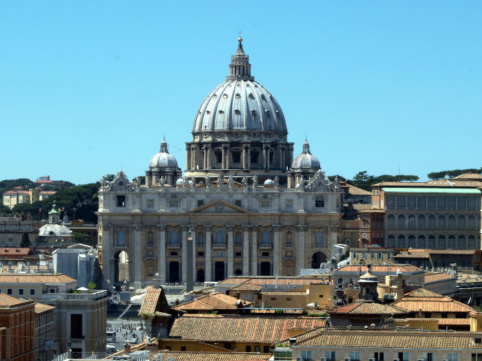Why is St. Peter wearing a sling in his statue at the Vatican?