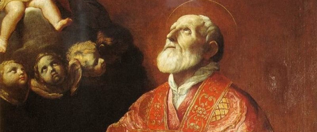 A classical religious painting of a bearded saint in red vestments gazing upward, with the Virgin Mary holding baby Jesus and angels surrounding them in a warm, golden-toned heavenly scene.