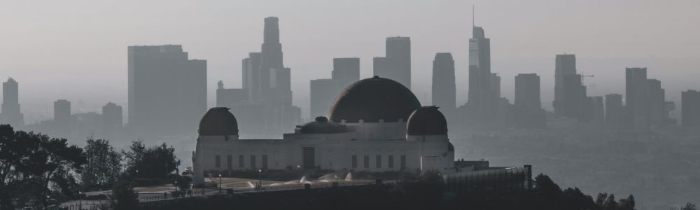 The observatory stands in the foreground, highlighting its domes and classic architecture.