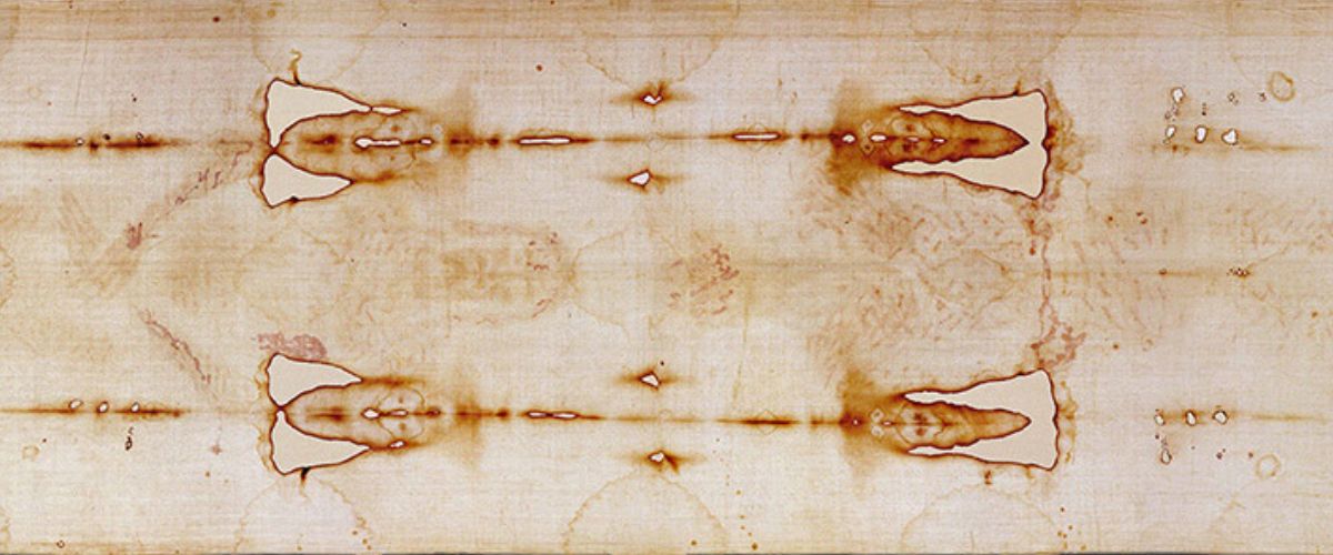 Faint monochrome image of a bearded man’s face with closed eyes, resembling the Shroud of Turin’s sacred relic impression.