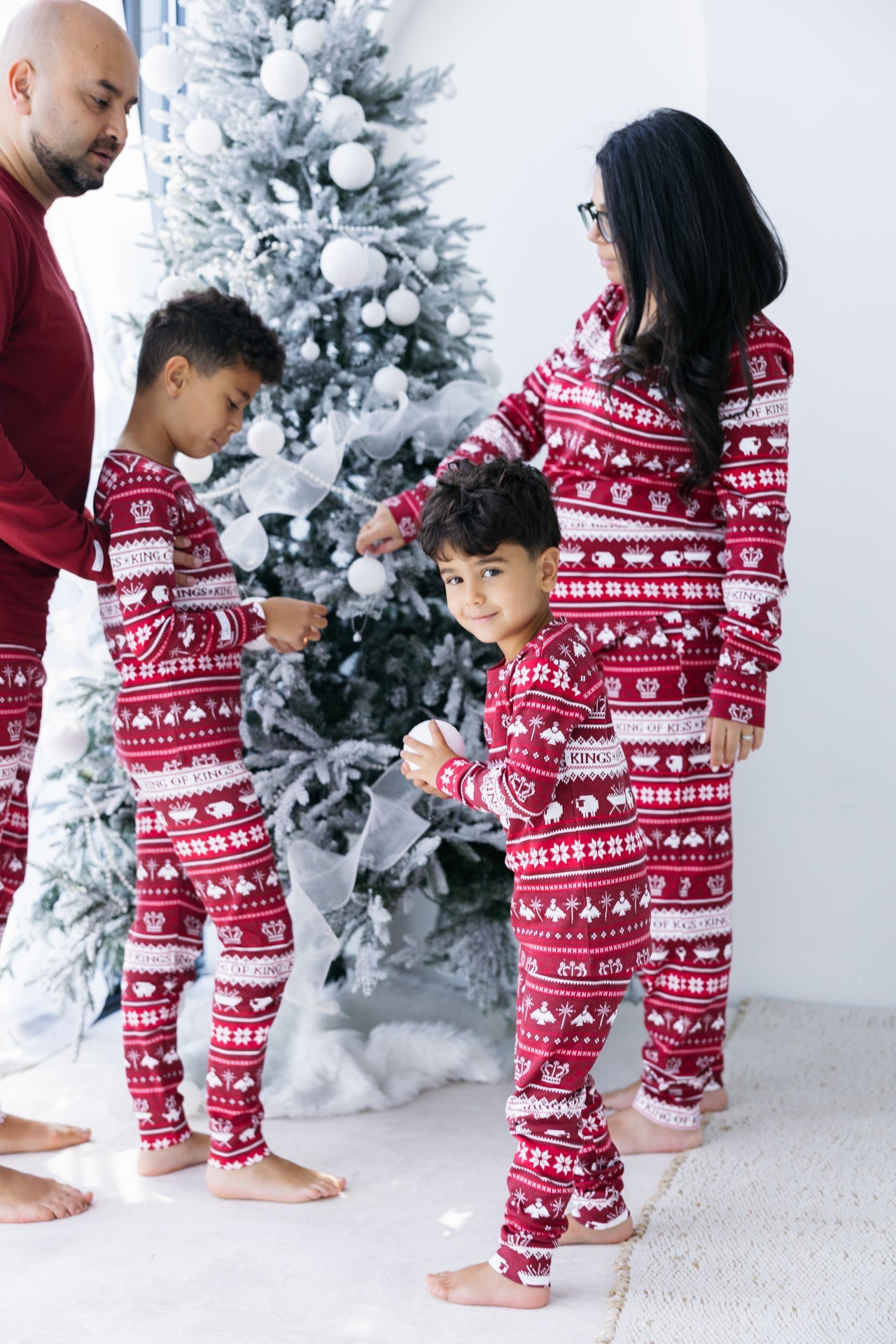 Matching red pajamas, cotton blend, family-style, with fair isle patterns for Christmas or winter holidays.