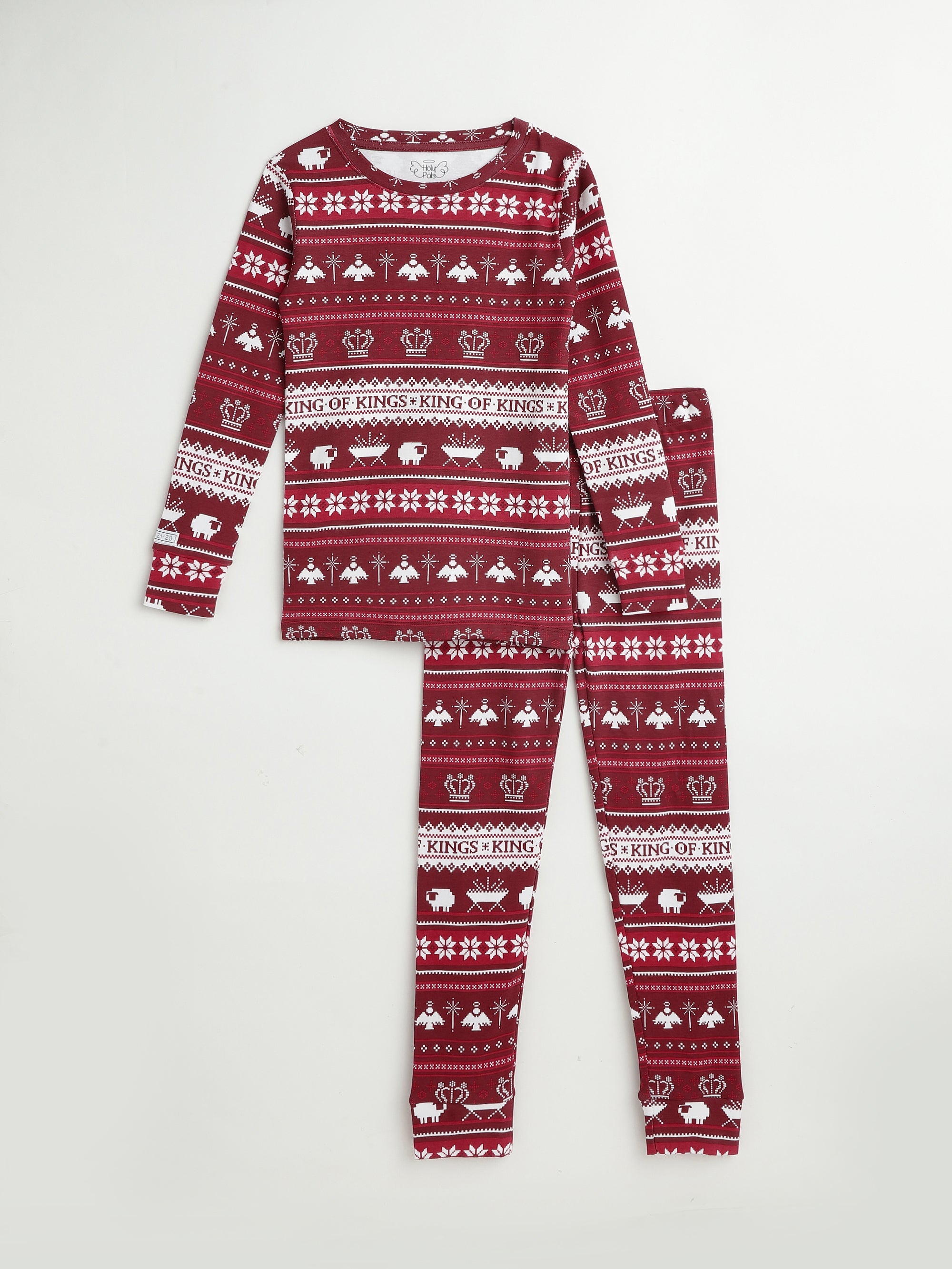 Burgundy pajama set with white fair isle-style Christmas print featuring snowflakes, crowns, angels, sheep, and mangers.