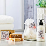 Peace + All Good products including soap, lotion, and bath bombs on a bathroom counter.