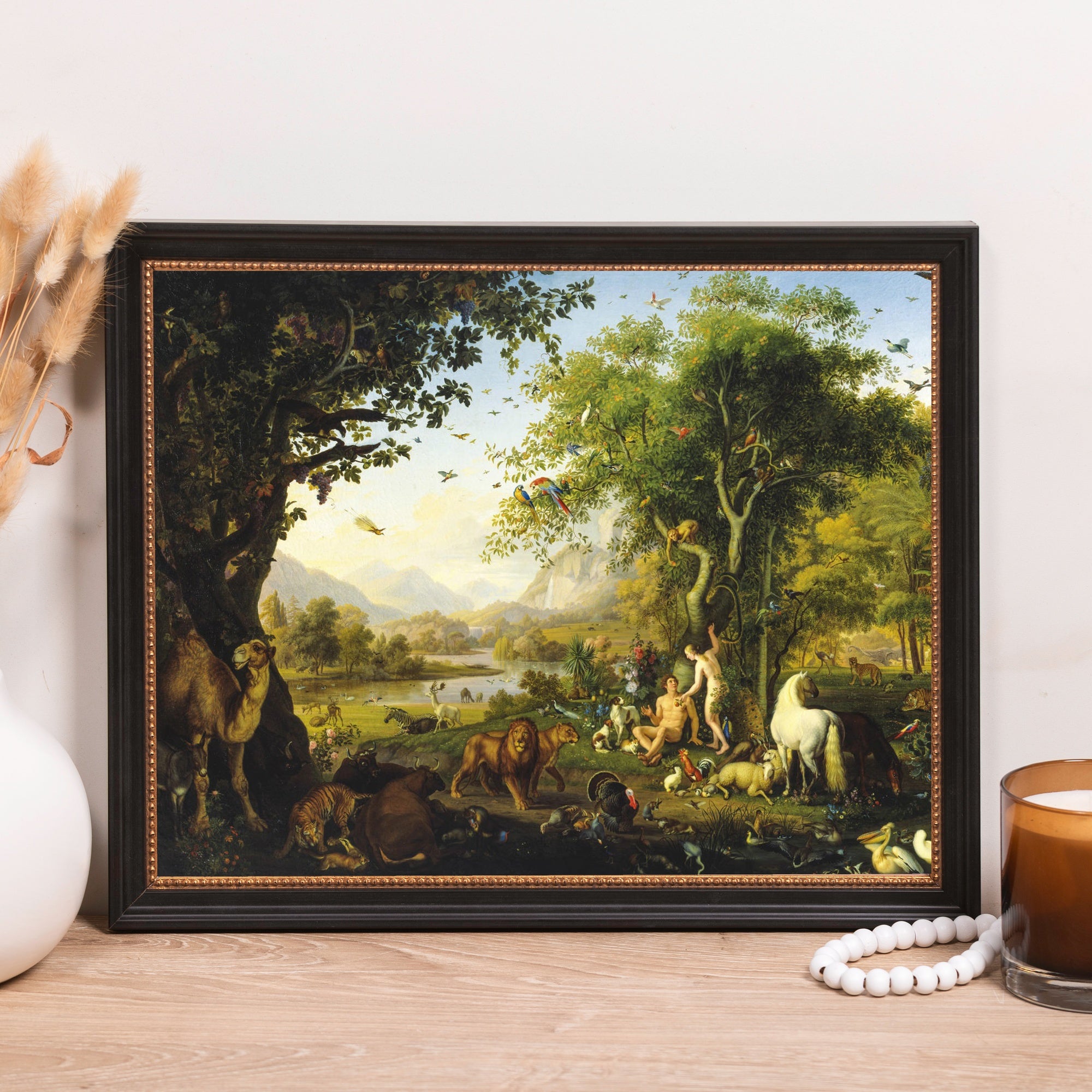 Framed "Paradise" print depicts Adam and Eve with animals in a lush garden scene.