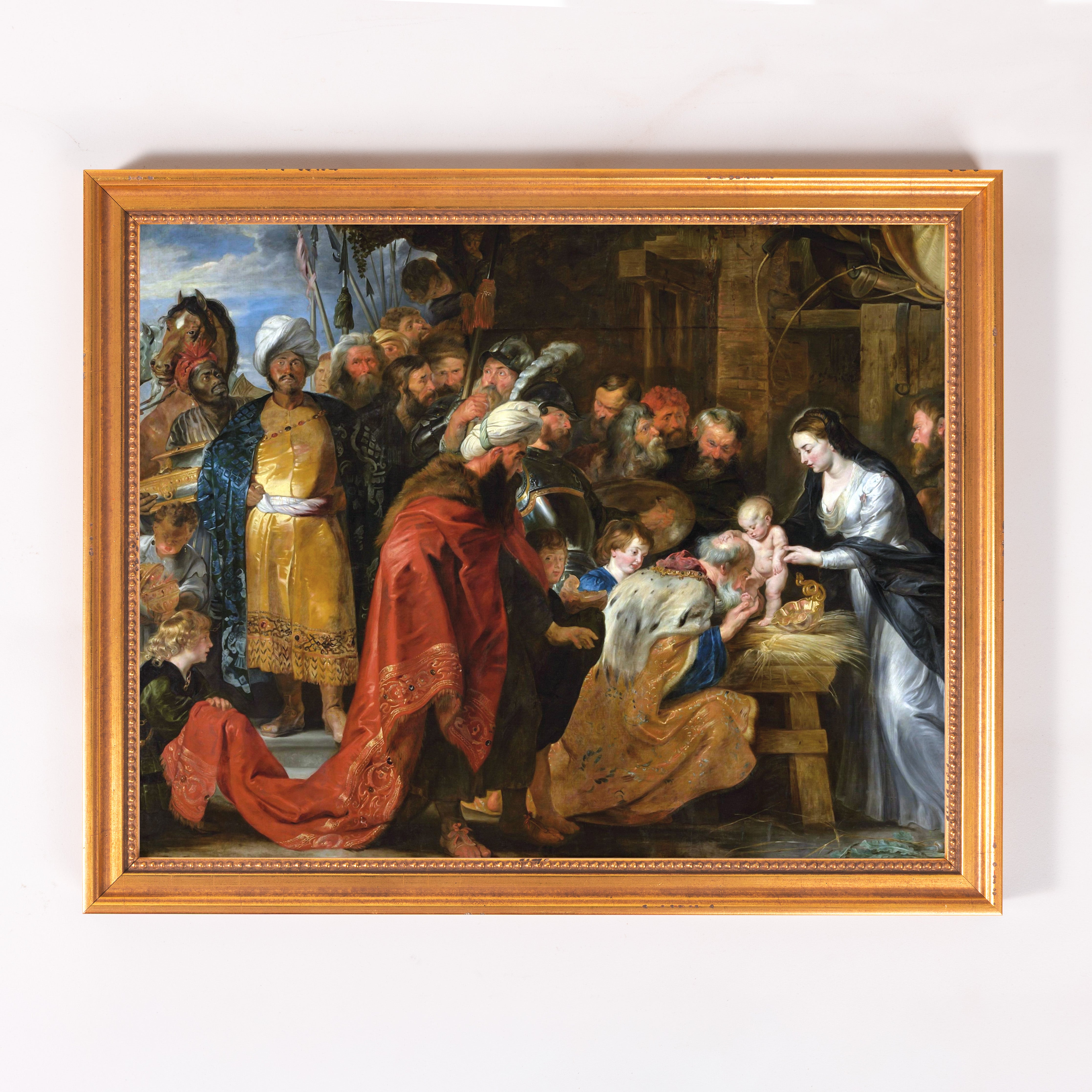 Framed oil painting showing the Adoration of the Magi, with gold frame.