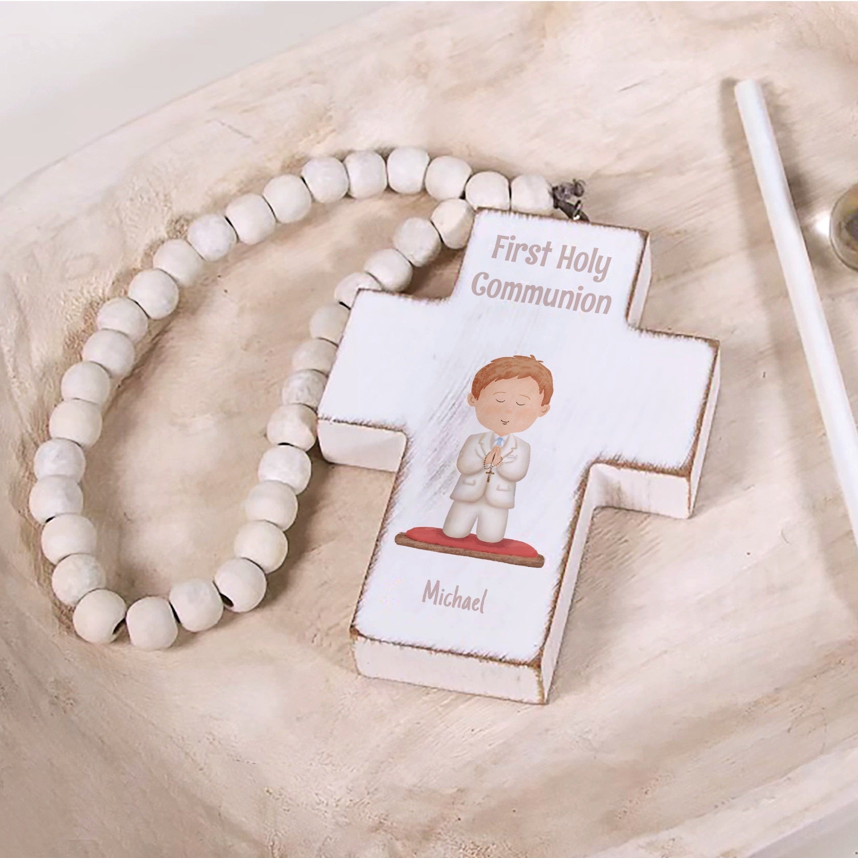 First Communion wood cross ornament with name, bead strand, and boy illustration.