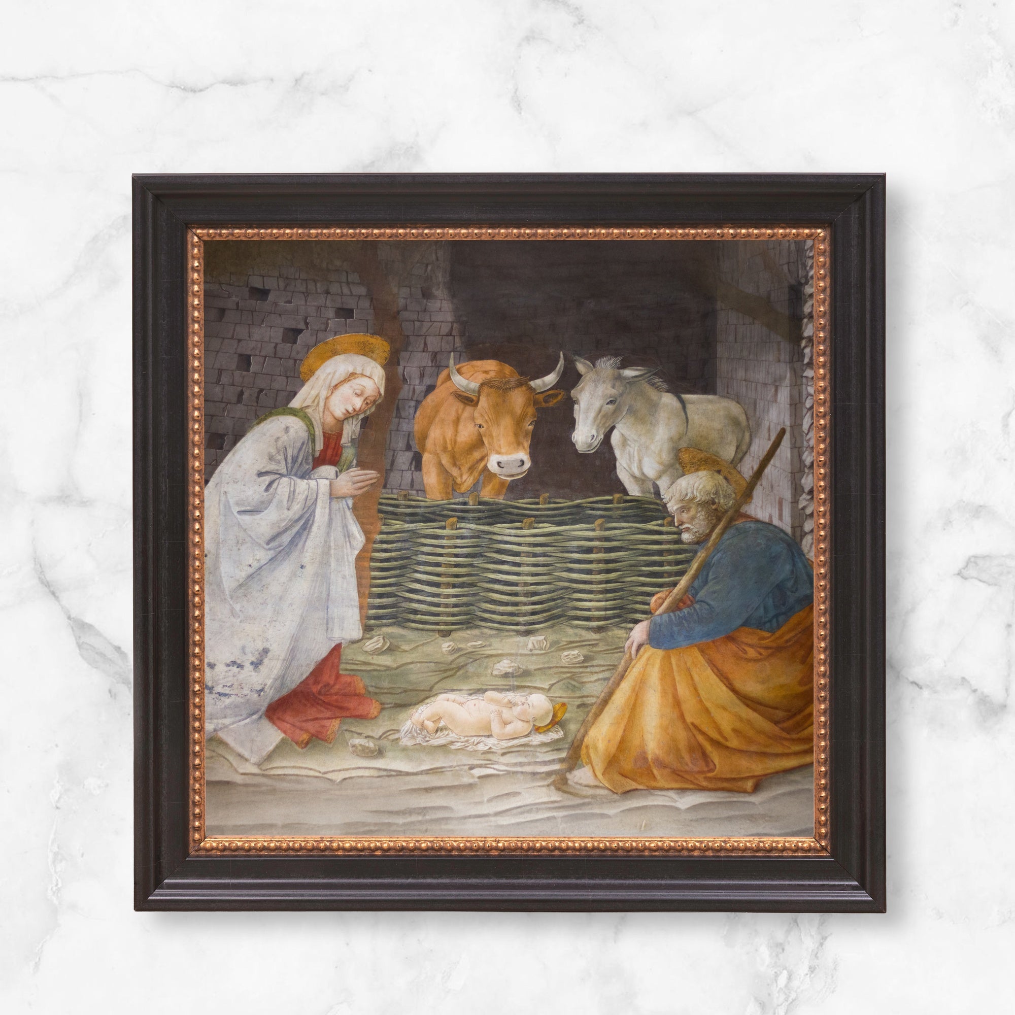 Framed art shows Nativity scene, with Mary, Joseph, baby Jesus, and animals, painted in a Renaissance style.