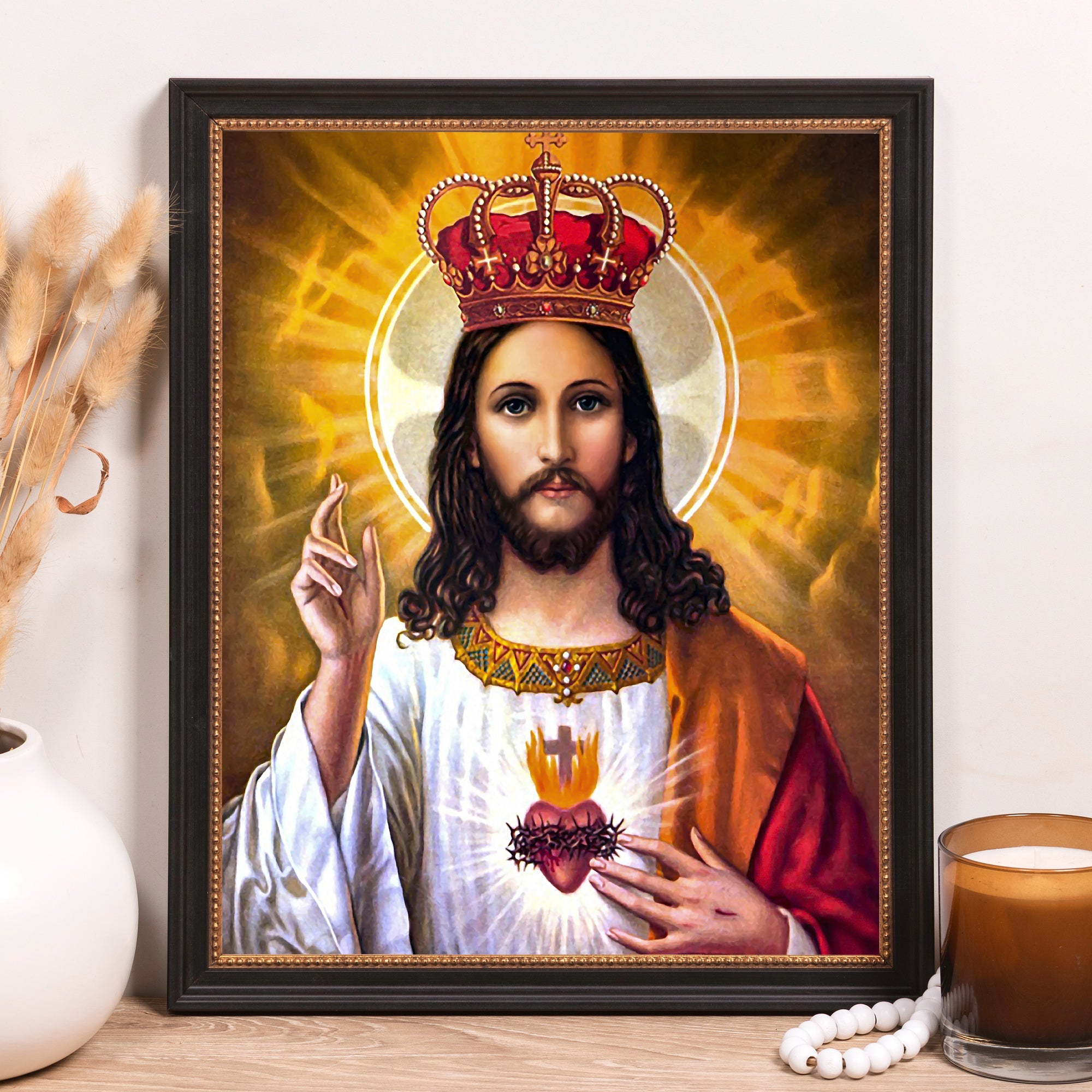 Framed print of Jesus Christ with a crown, in a black frame.