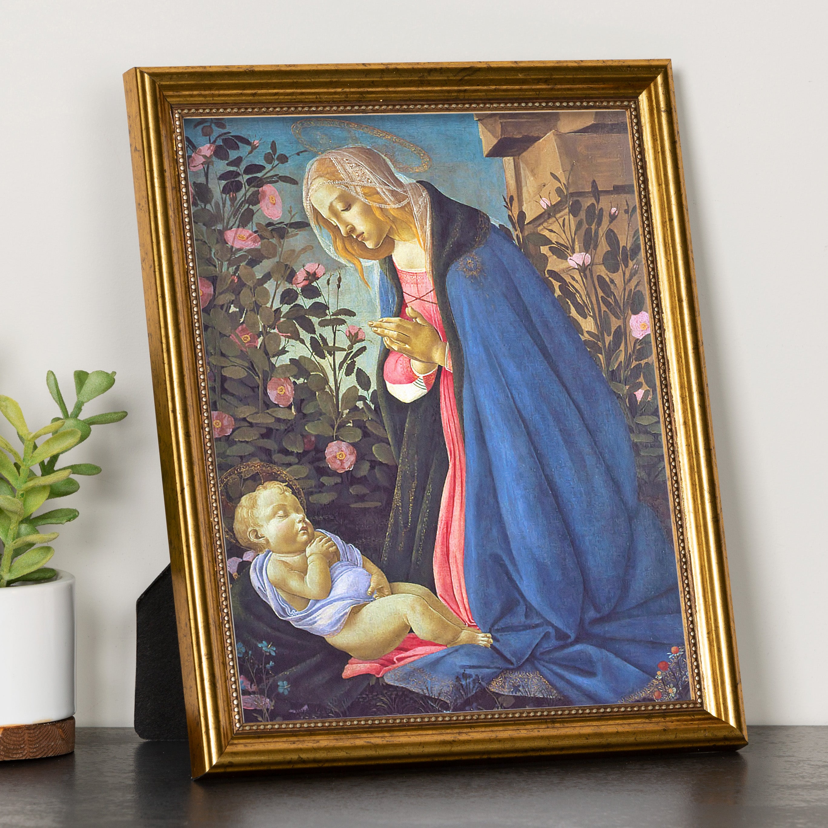 Framed wall art print of Madonna and child in gold frame.