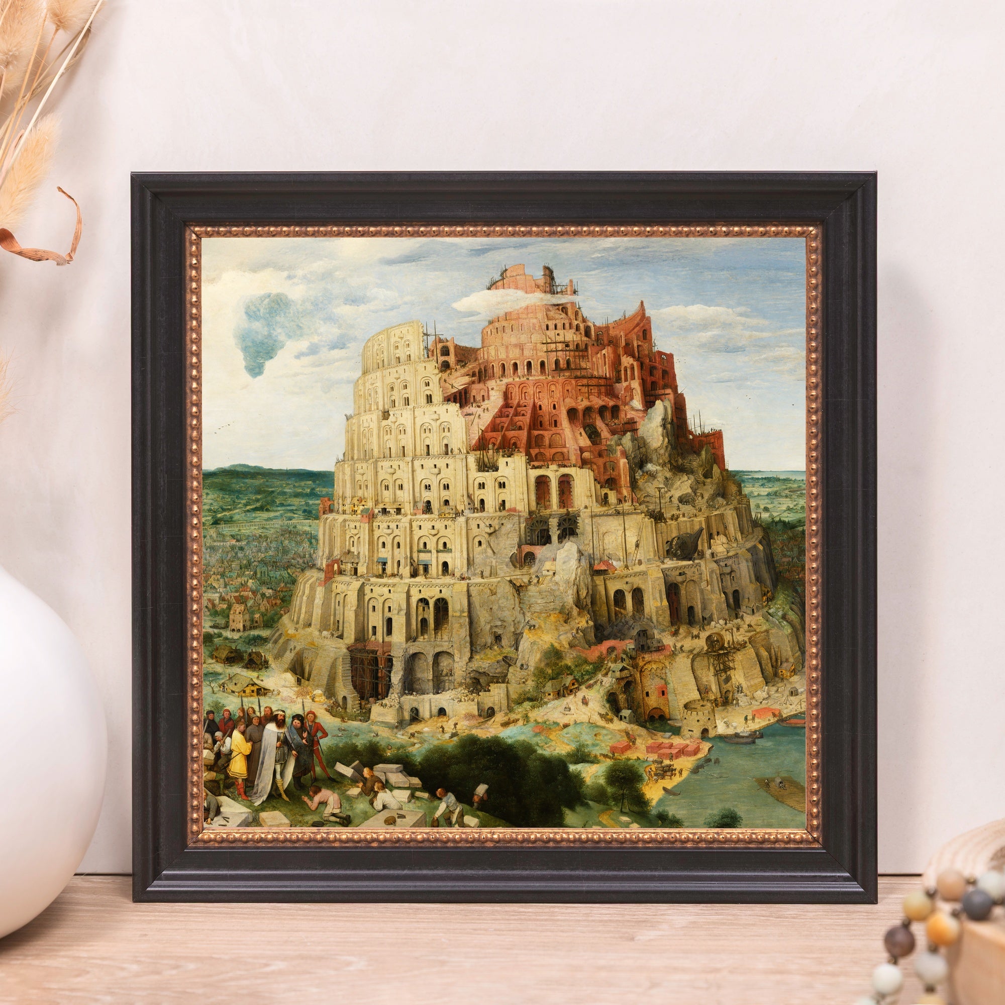 Framed print of The Tower of Babel artwork; black frame with brown trim.