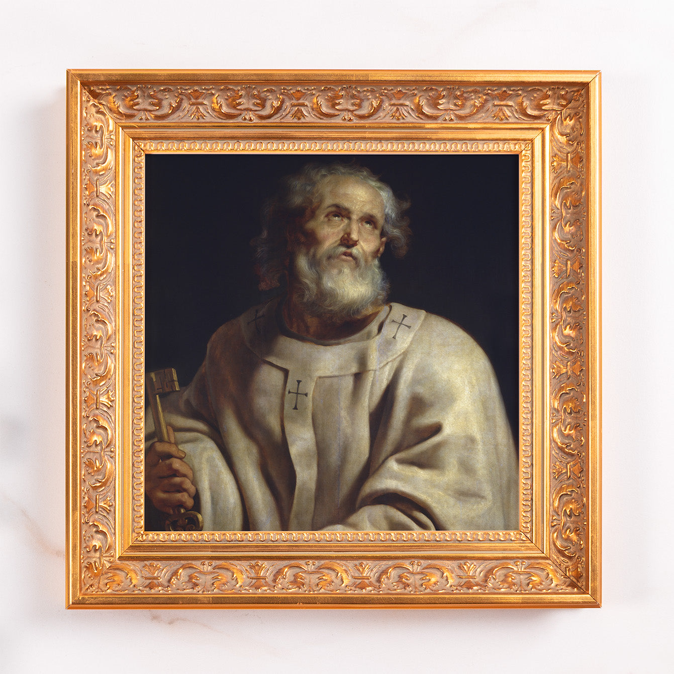 Framed painting of an old man holding a key in a gold ornate frame.