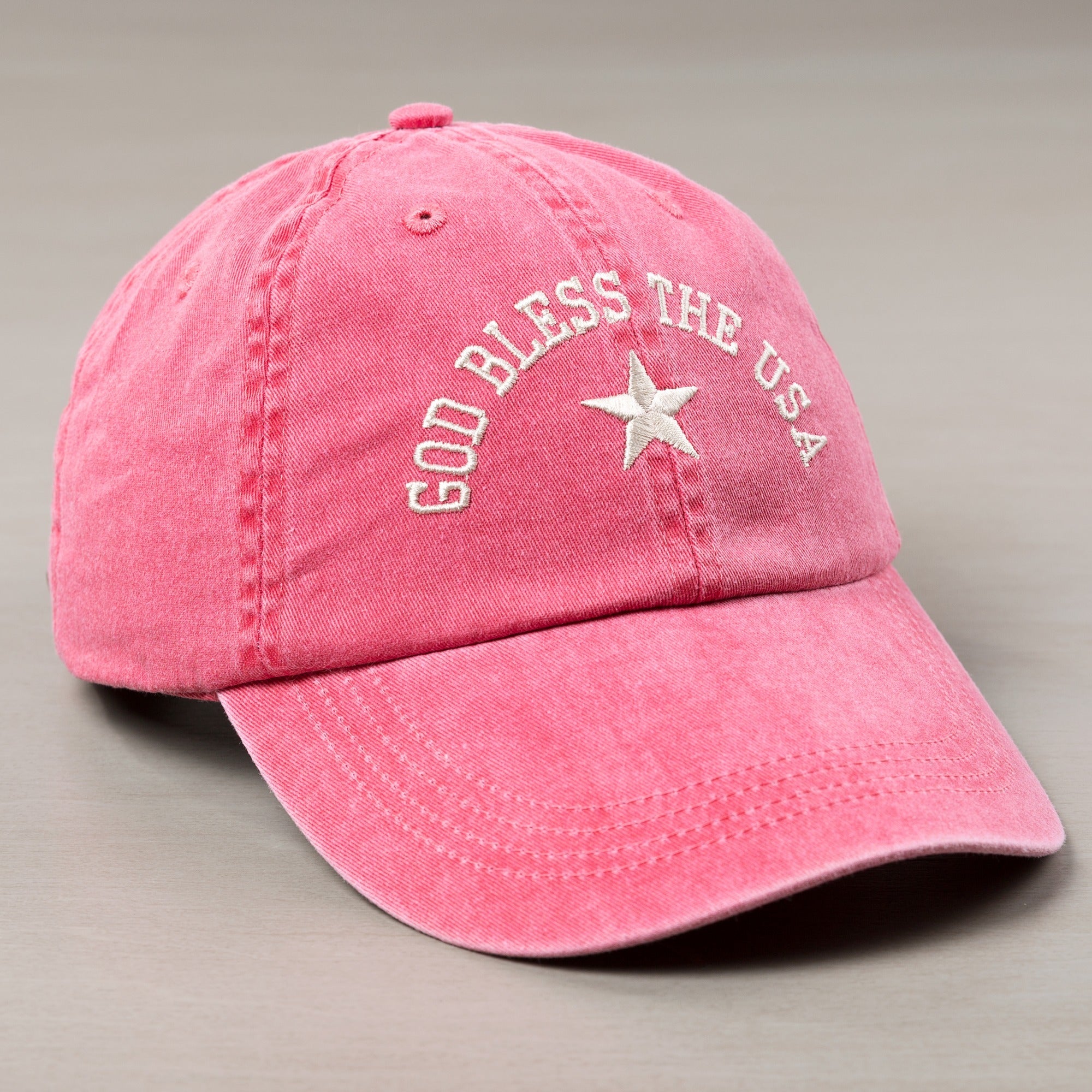 Pink cotton hat with "God Bless The USA" embroidery and a star.