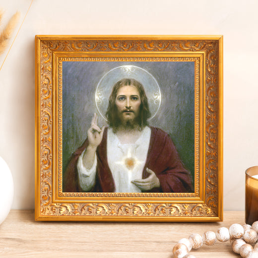 Framed artwork of Jesus with sacred heart in ornate, golden frame for home decor and religious display.