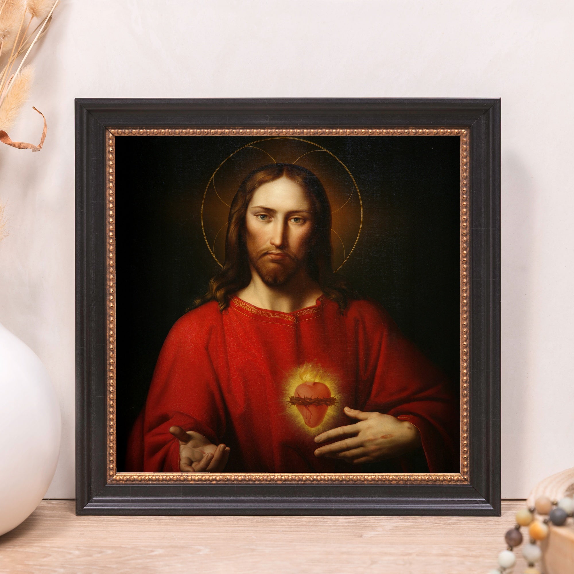 Framed art print of Jesus Christ with Sacred Heart in red robe and gold halo.