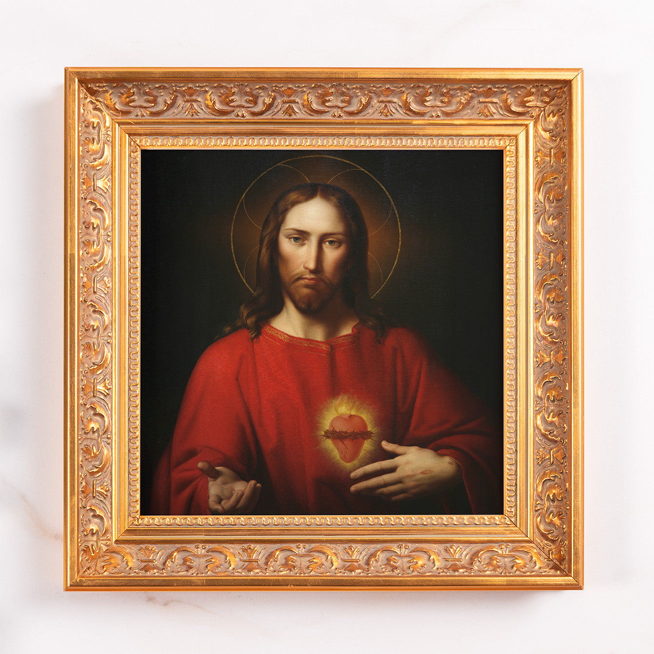 Framed painting of Jesus Christ with a golden halo and a sacred heart in an ornate gold frame.
