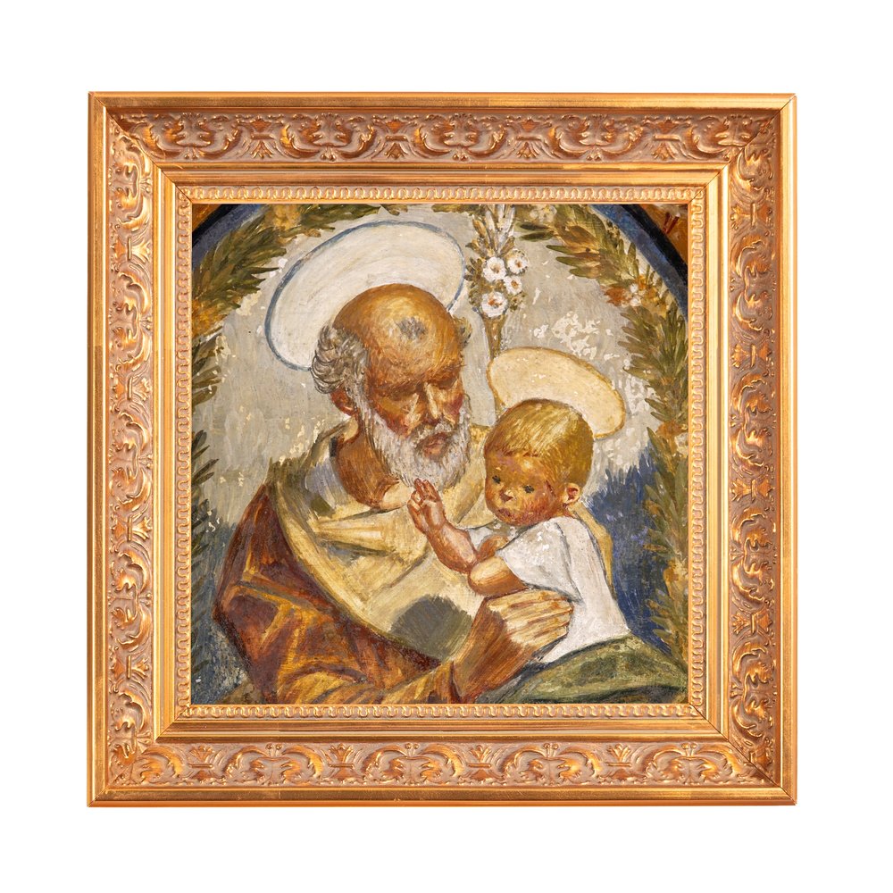 Framed oil painting of St. Joseph and Jesus, with gold frame and haloed figures.