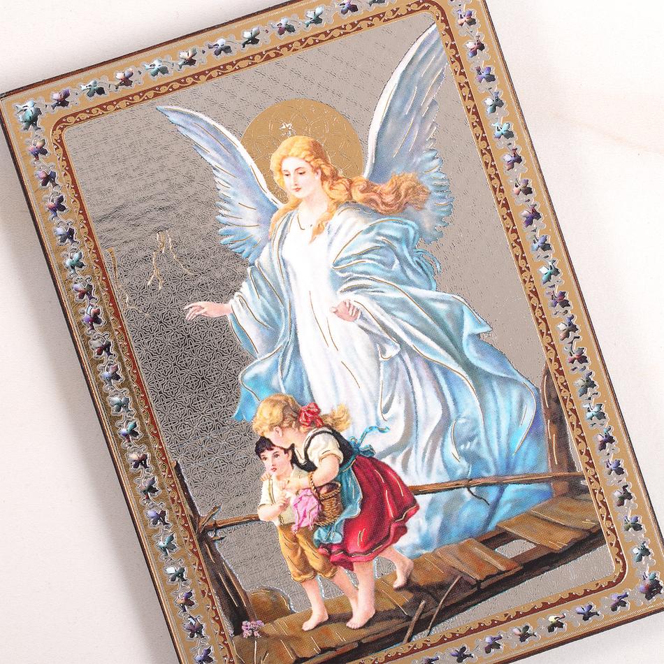 Religious, prayer card featuring an angel watching over two children on a bridge, framed with silver and small jewels.