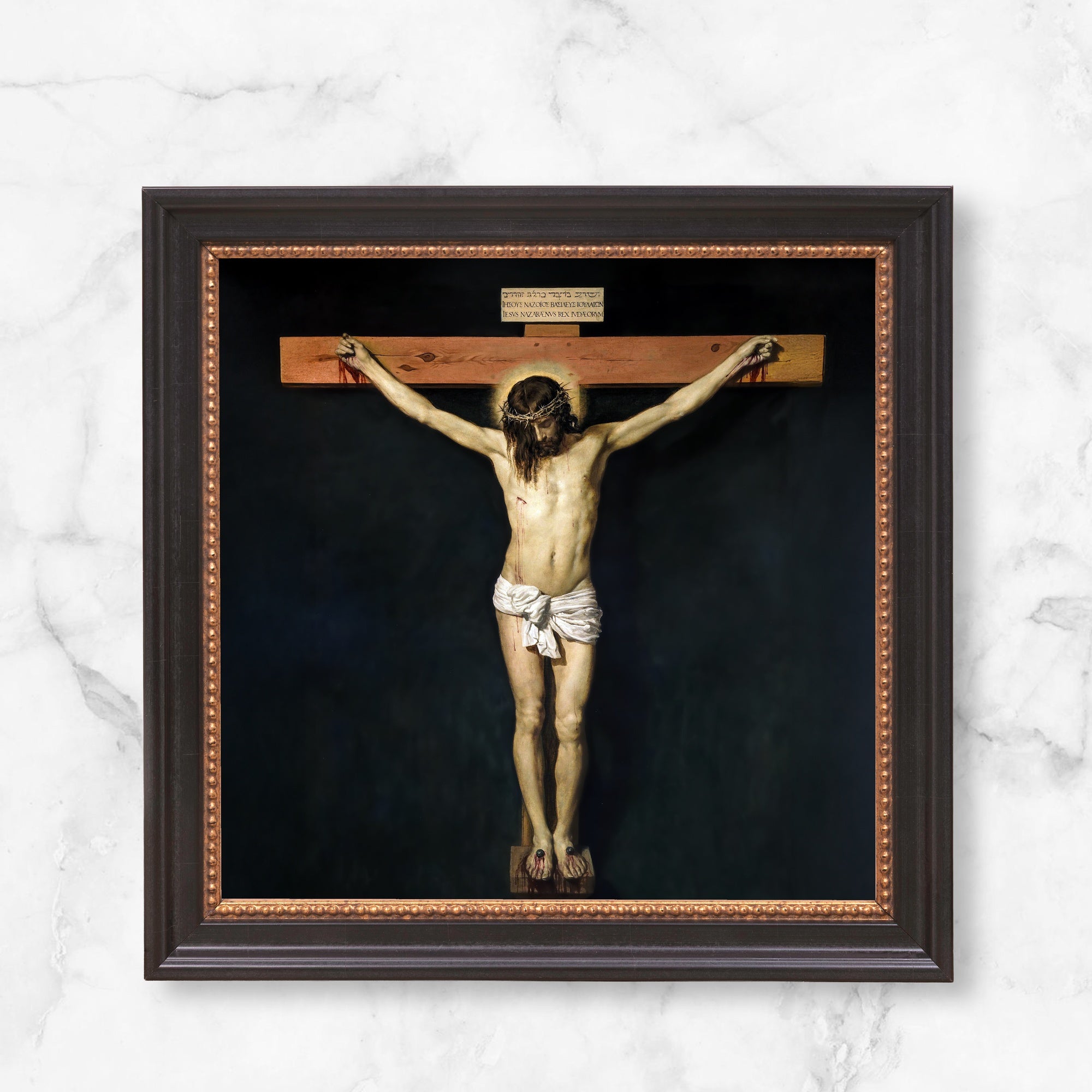 Framed crucifixion painting. Christ on wood cross, set against black background, with dark wood frame.