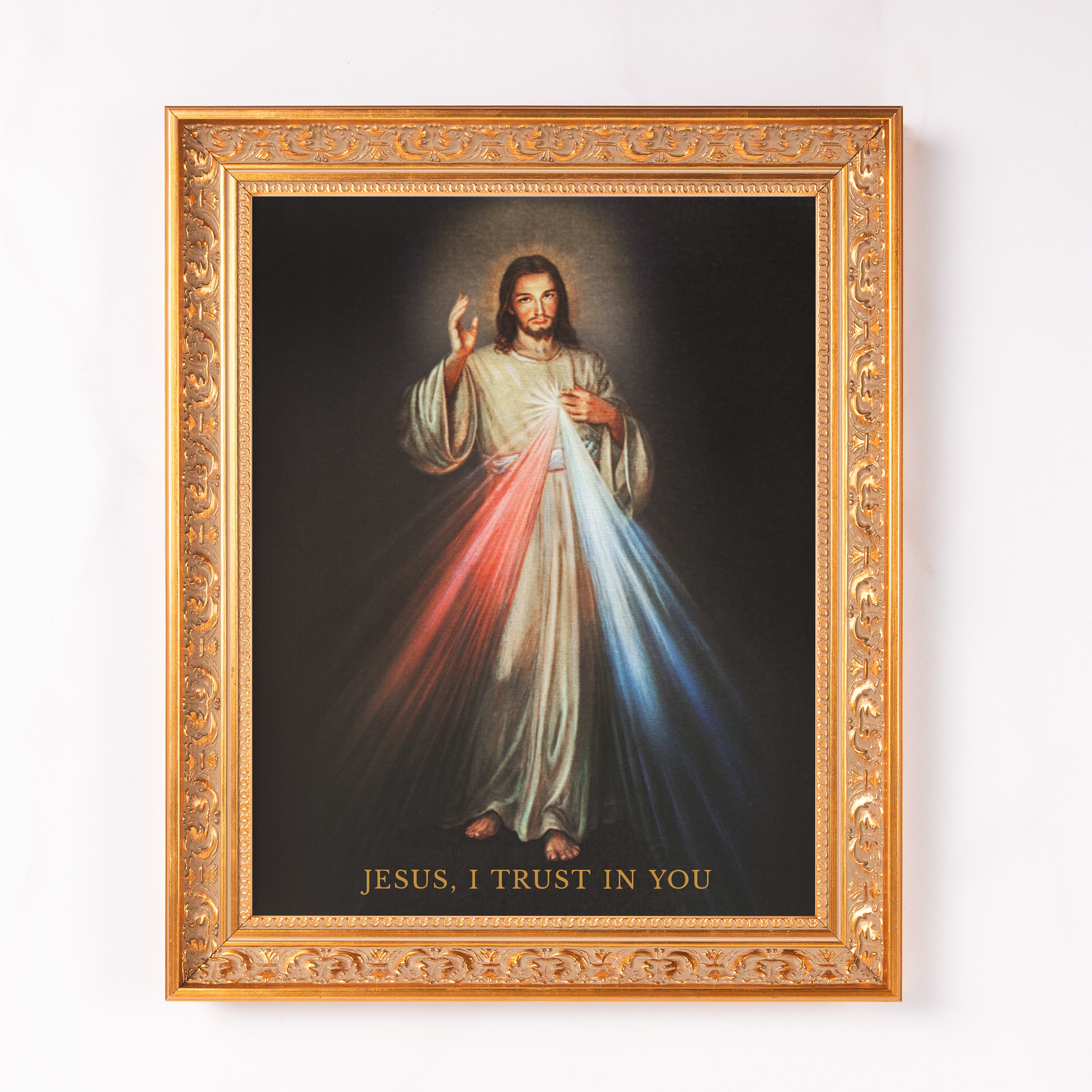 Framed canvas print of Jesus, decorative gold frame.
