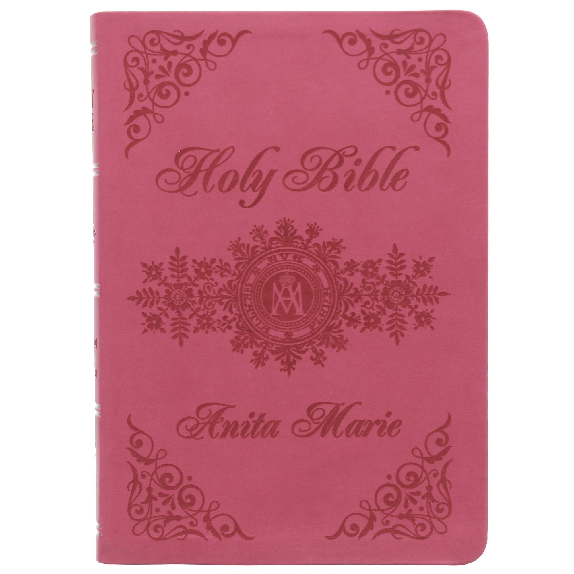 Pink, faux leather Holy Bible with floral accents and a custom name imprint in elegant script font.