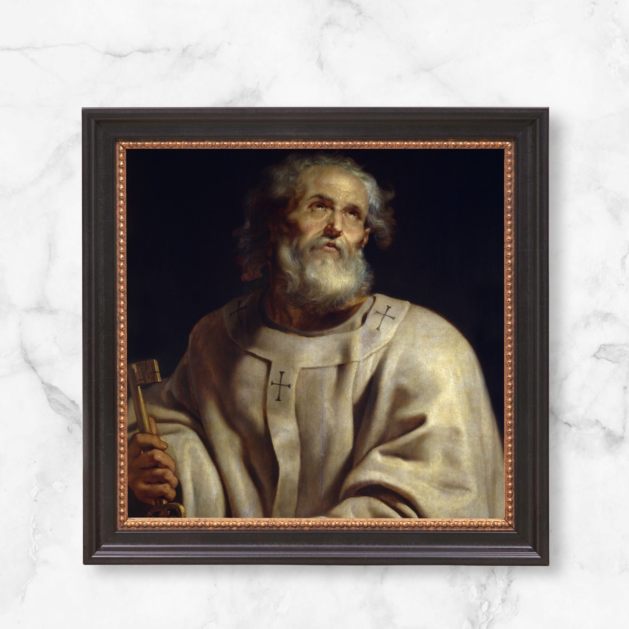 Framed art depicting a biblical figure in a tunic with crosses, holding keys in a dark wood frame.