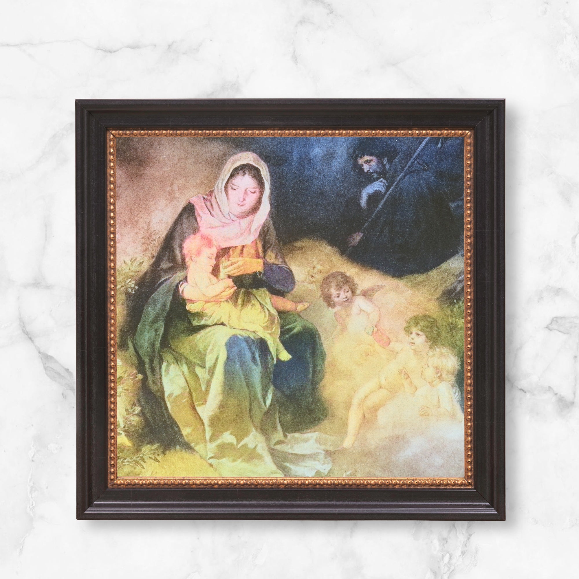 Framed print of Madonna and Child with angels.