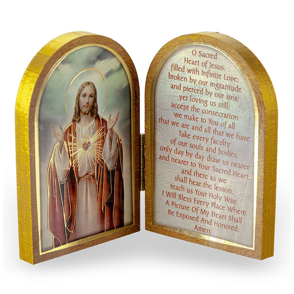 Wooden prayer book depicting Jesus on one side, and printed prayer on the other, both within an arched frame.