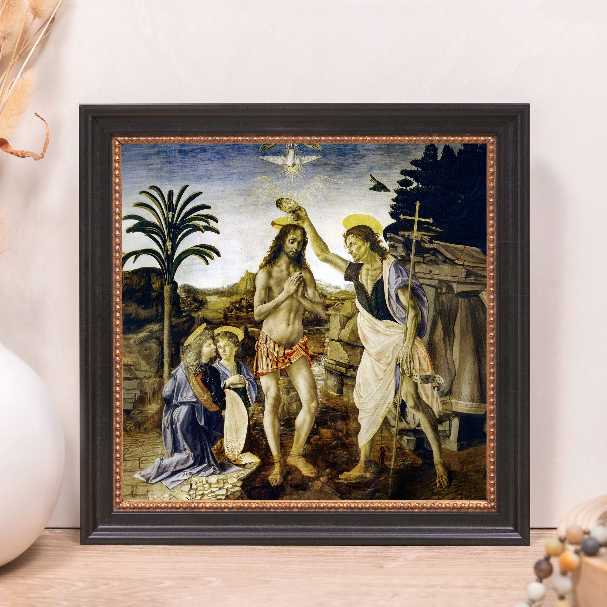 Framed Baptism print in blue, gold, and brown depicts John baptizing Jesus.
