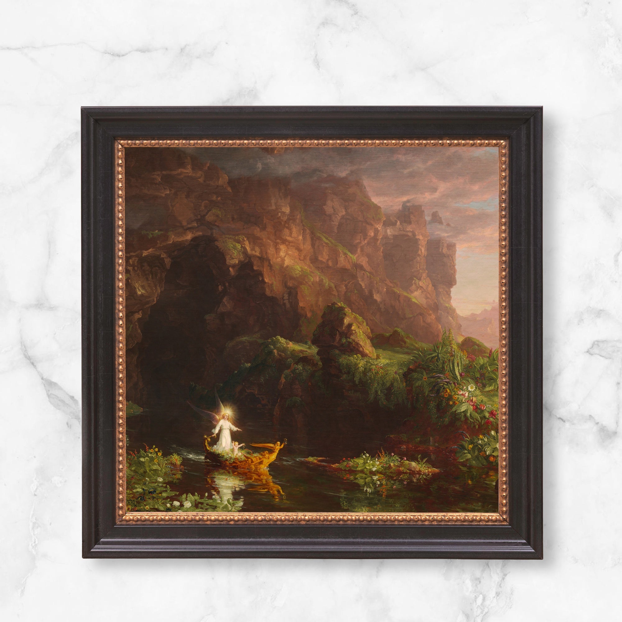 Framed painting depicting an angel and child on a golden boat in a lush landscape.