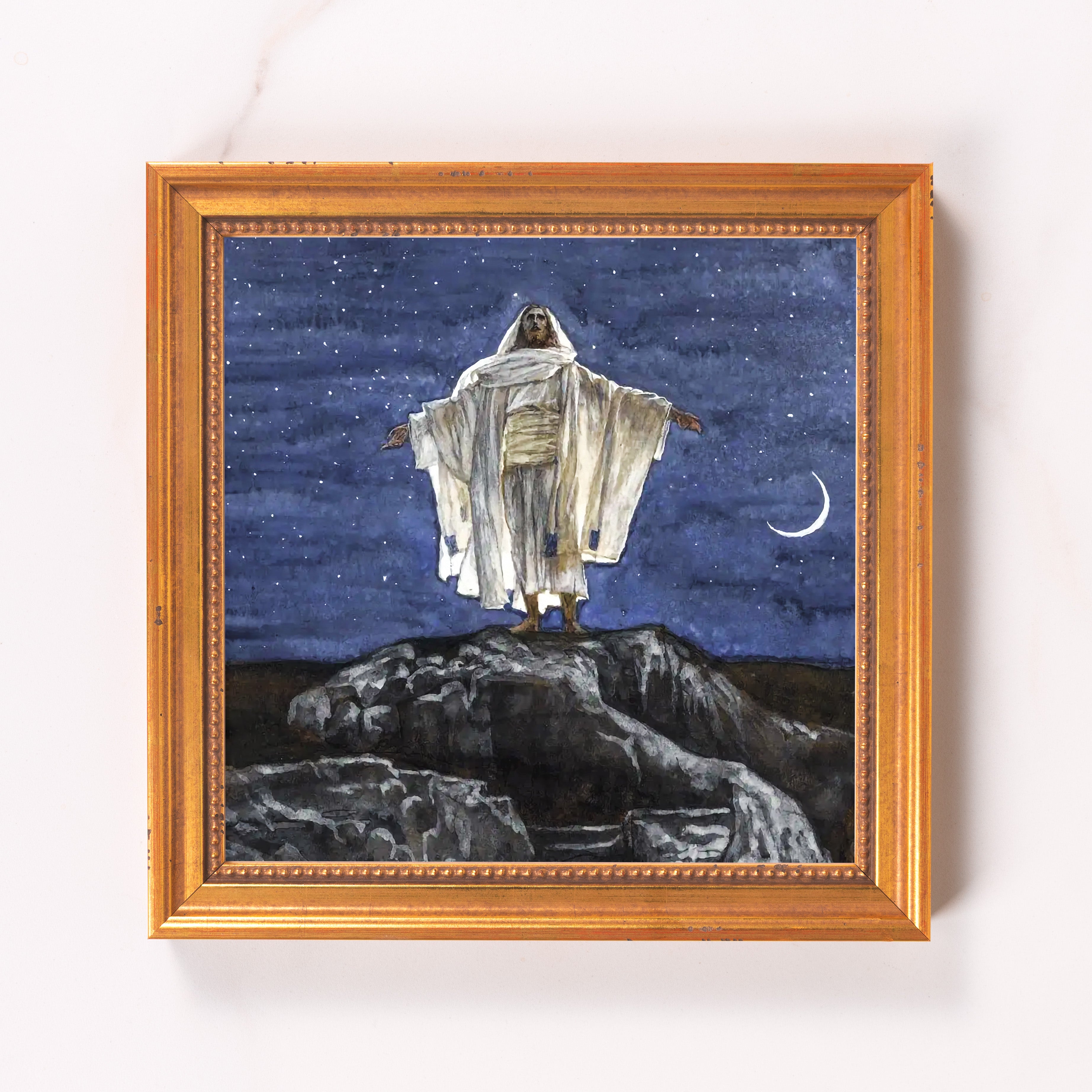 Framed art print depicting Jesus standing on a hill under a starry night sky with crescent moon.