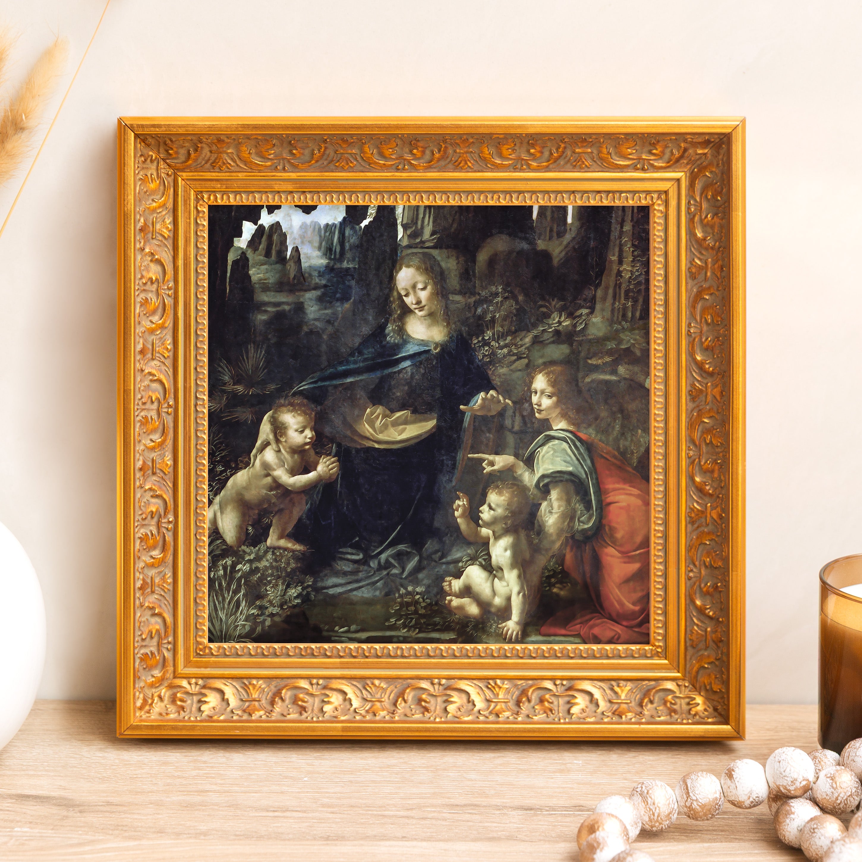 Framed "Virgin of the Rocks" print; Leonardo da Vinci art in gold ornate frame.
