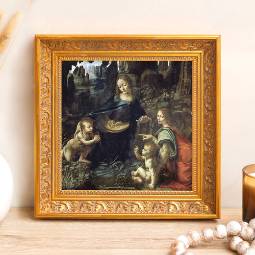 Framed "Virgin of the Rocks" print; Leonardo da Vinci art in gold ornate frame.