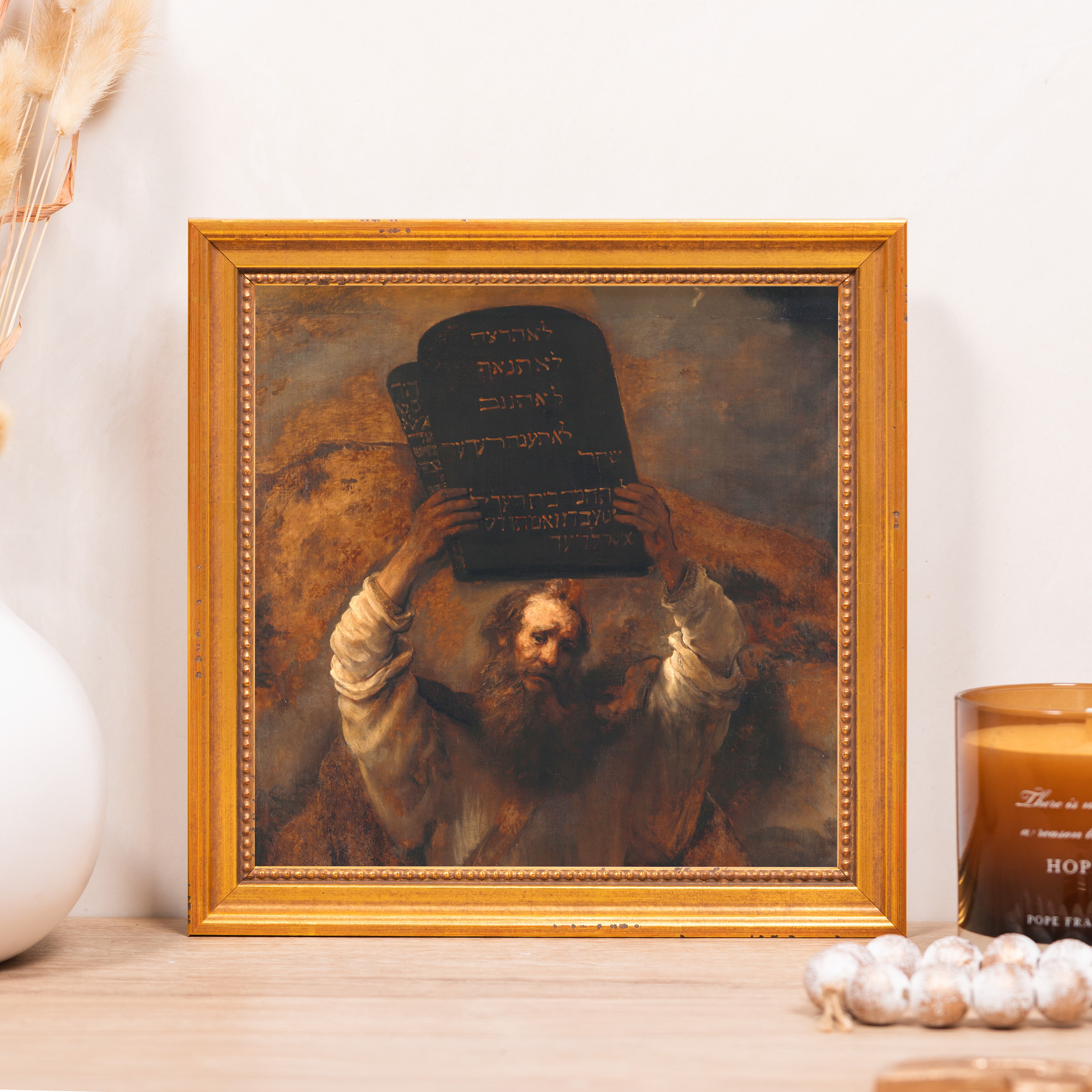Moses Holding the Ten Commandments art print with gold frame shows an oil painting reproduction with Hebrew text.