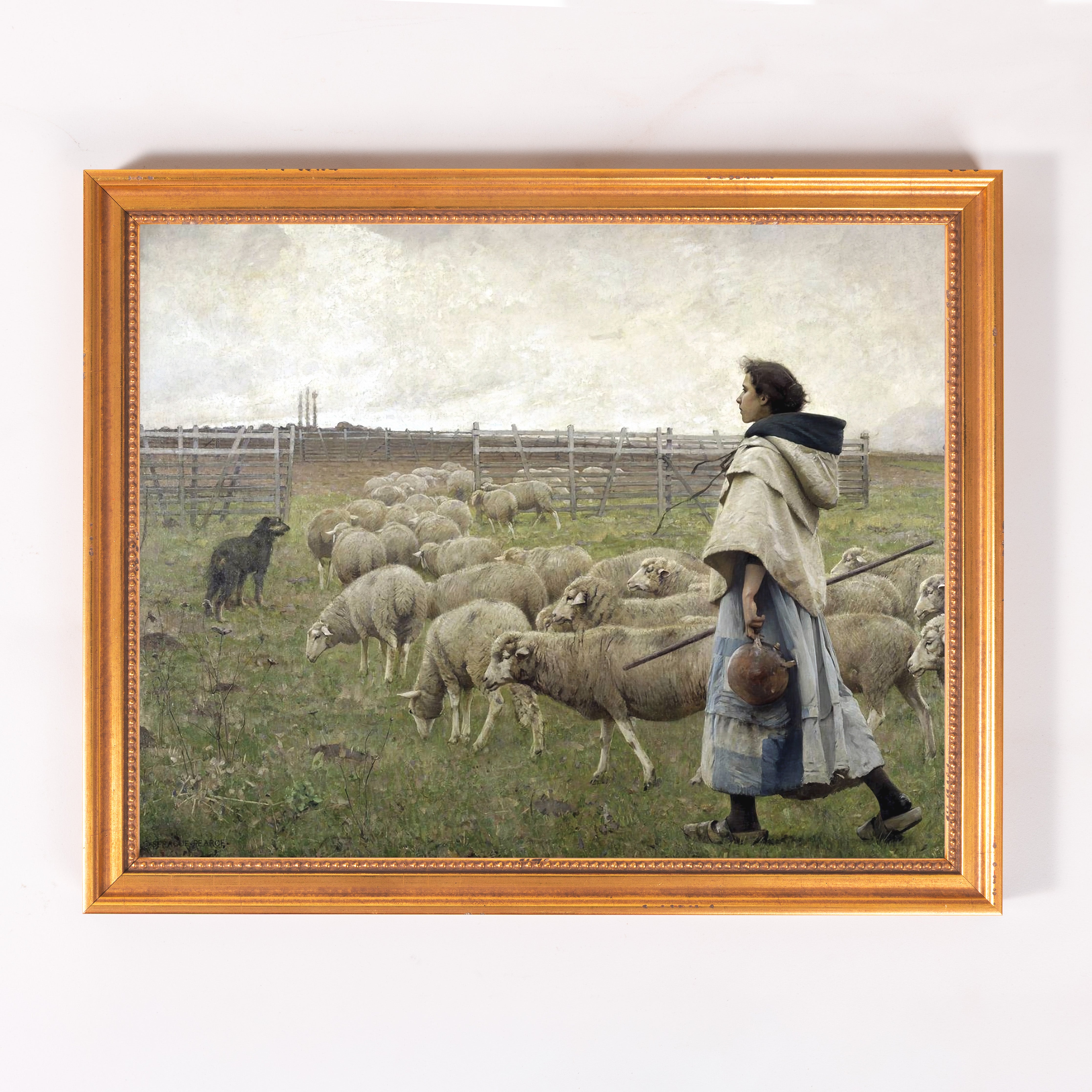 Framed oil painting of a shepherdess with sheep in a field, displayed in a gold frame.