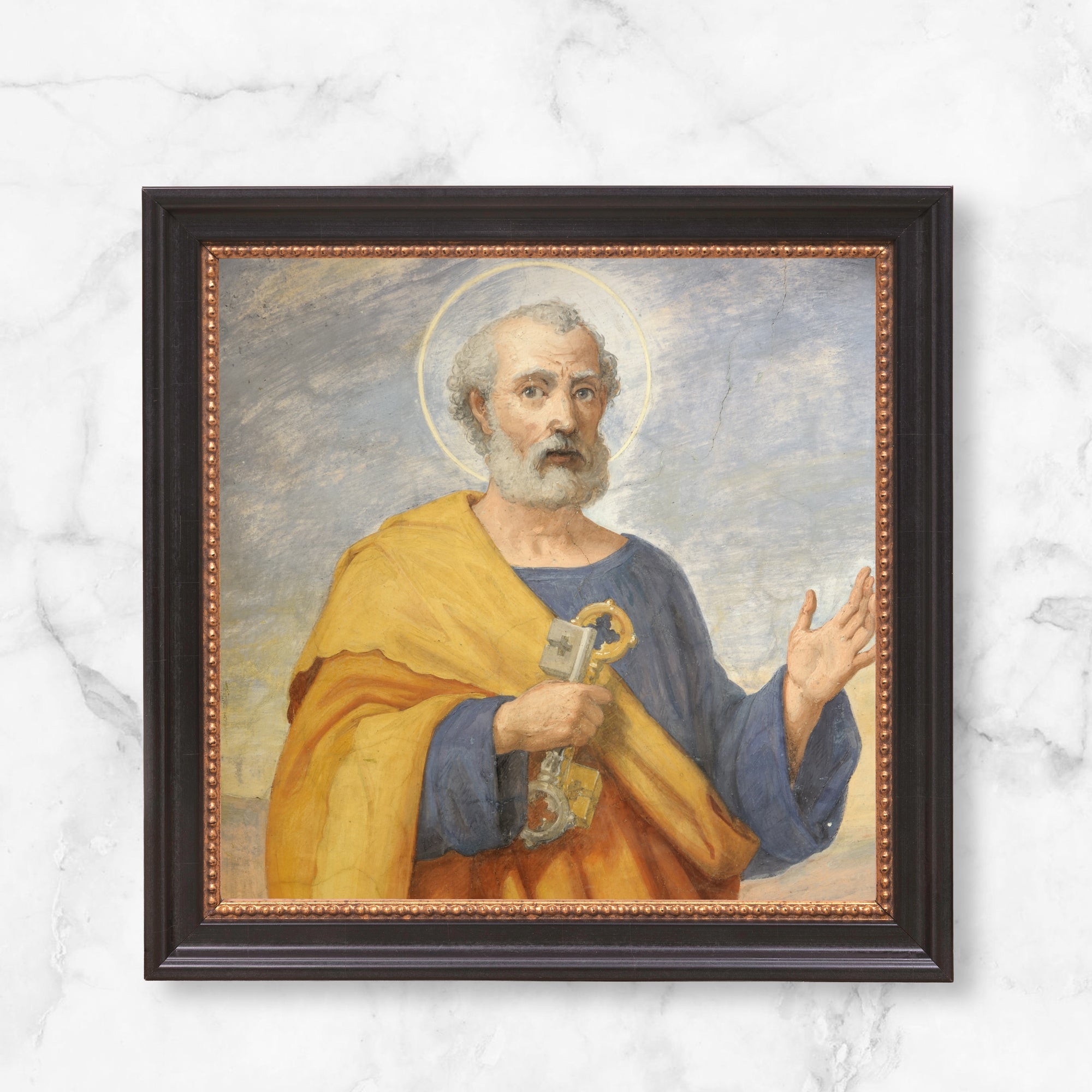 Framed painting of St. Peter holding keys, in blue and yellow robes, black wood frame.