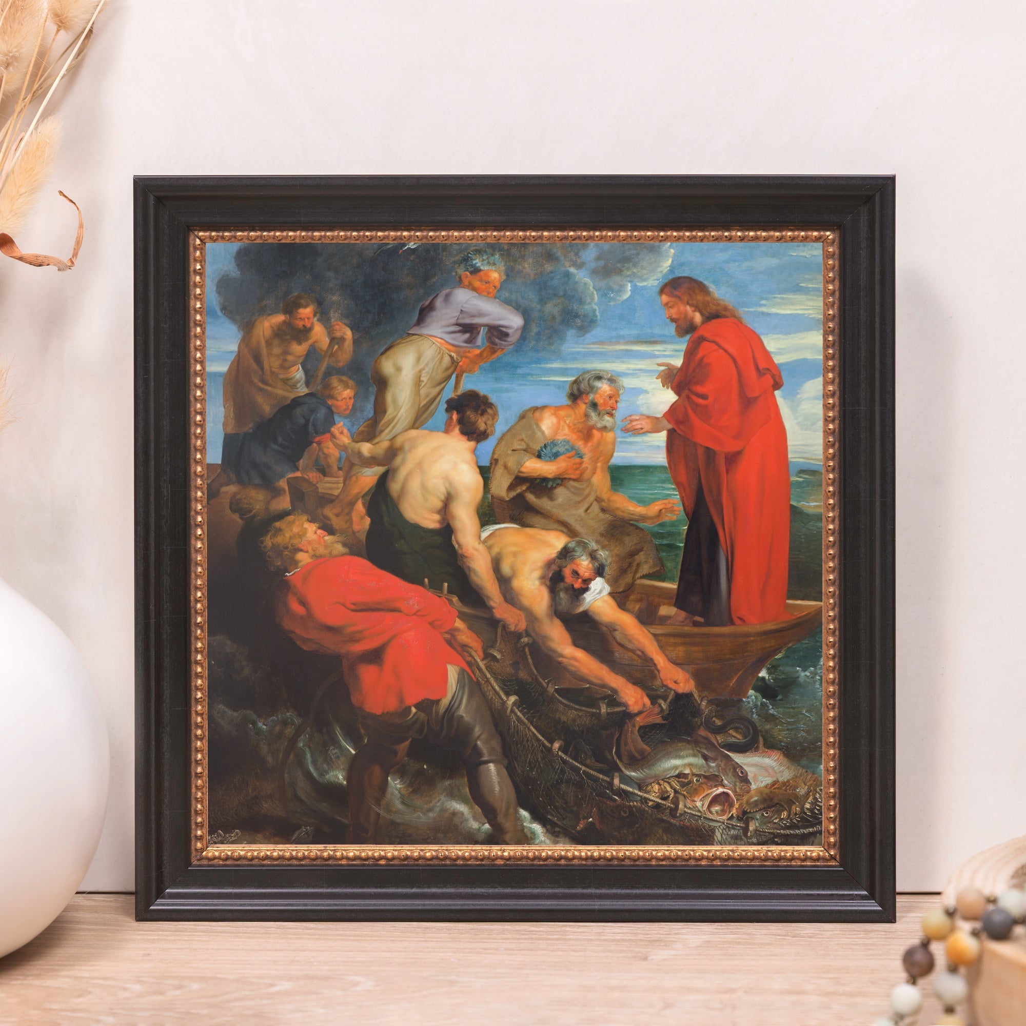 Framed "Miraculous Draught of Fishes" print. Black frame with a gold beaded inner trim surrounds the biblical art.