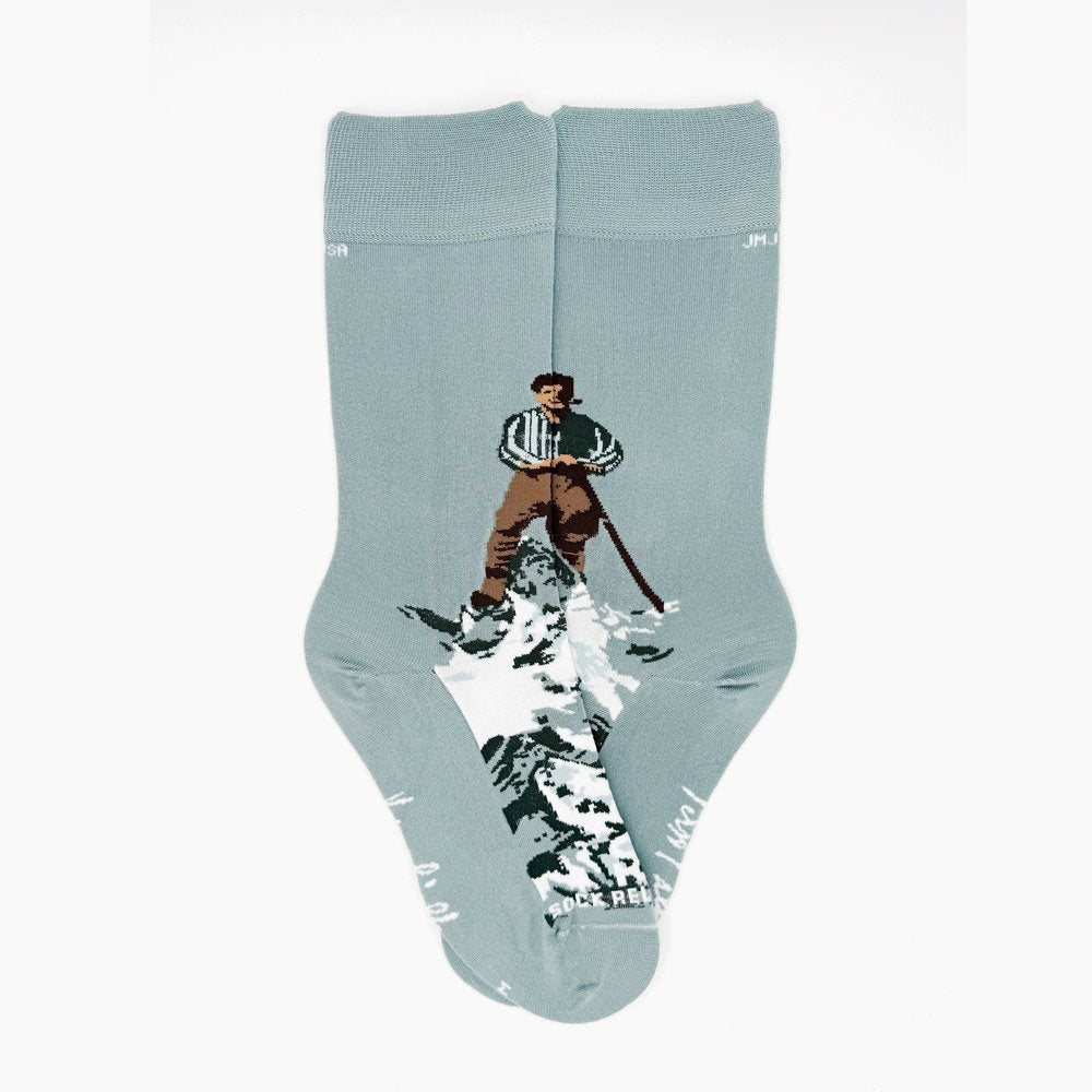 Gray socks feature a man skiing on snow, crafted in a classic style.