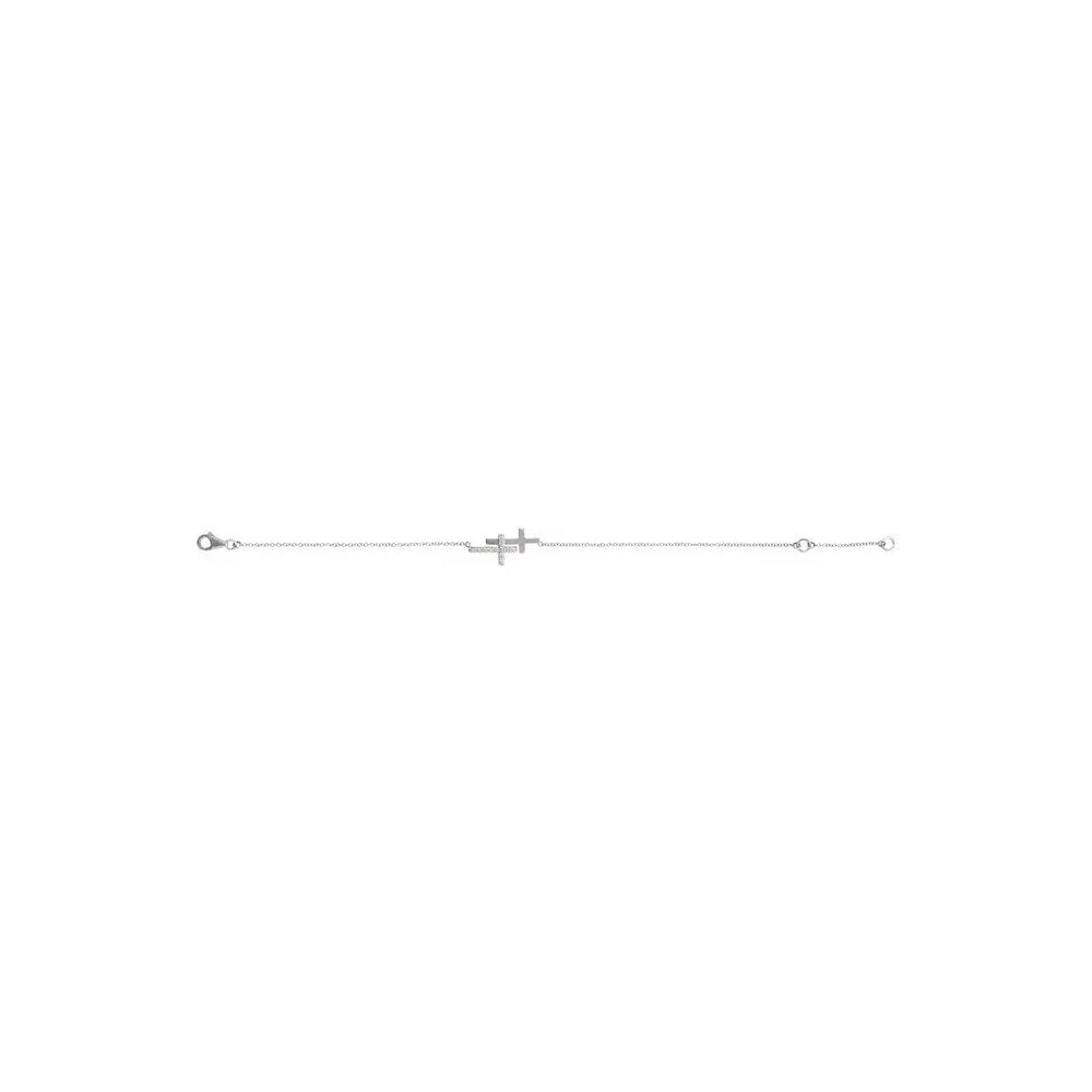 Silver bracelet with a delicate chain and cross charm in the center, against a white background.