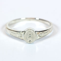 Silver-colored metal ring with a Miraculous Medal-style design on the band.