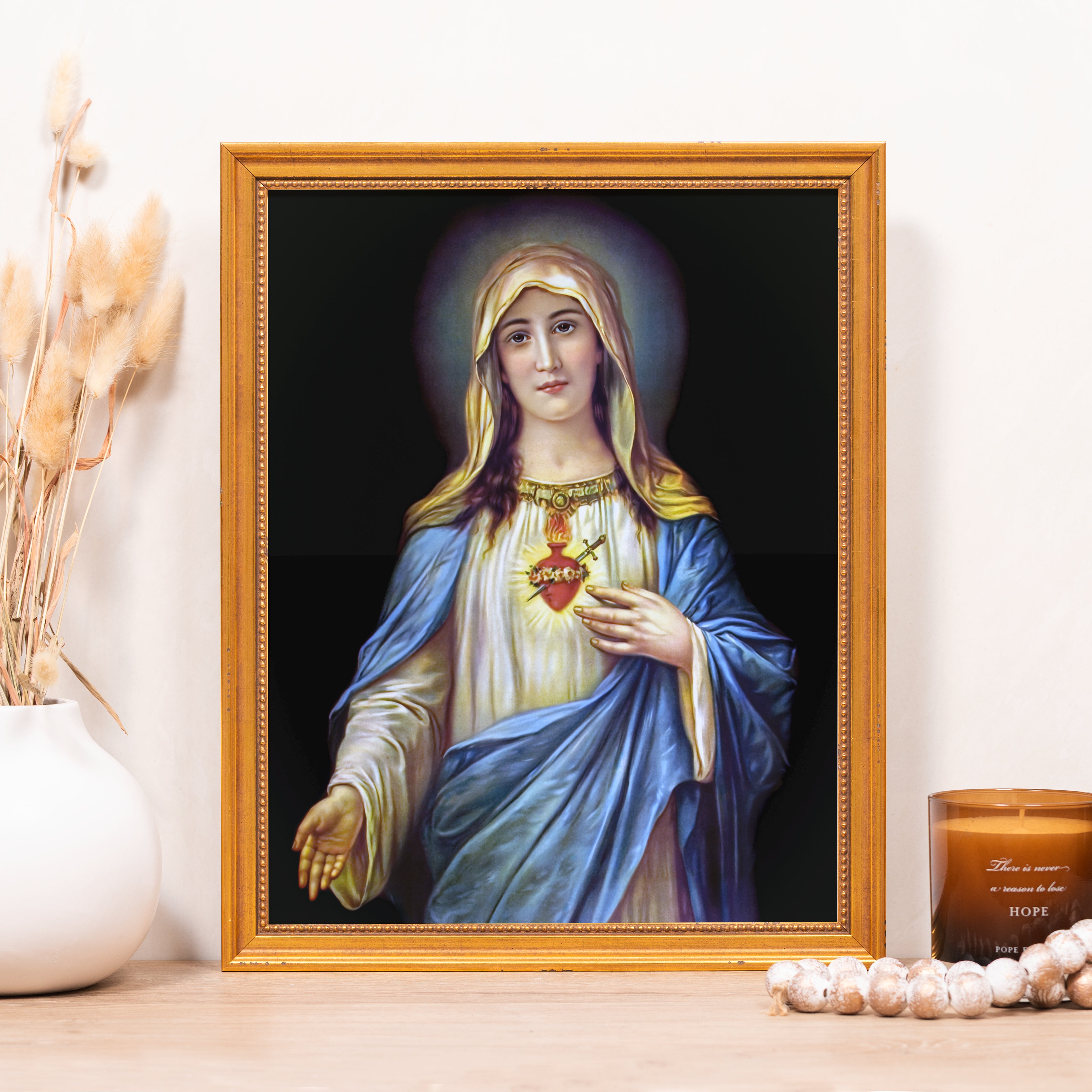 Framed Immaculate Heart of Mary art print with gold frame and blue gown.