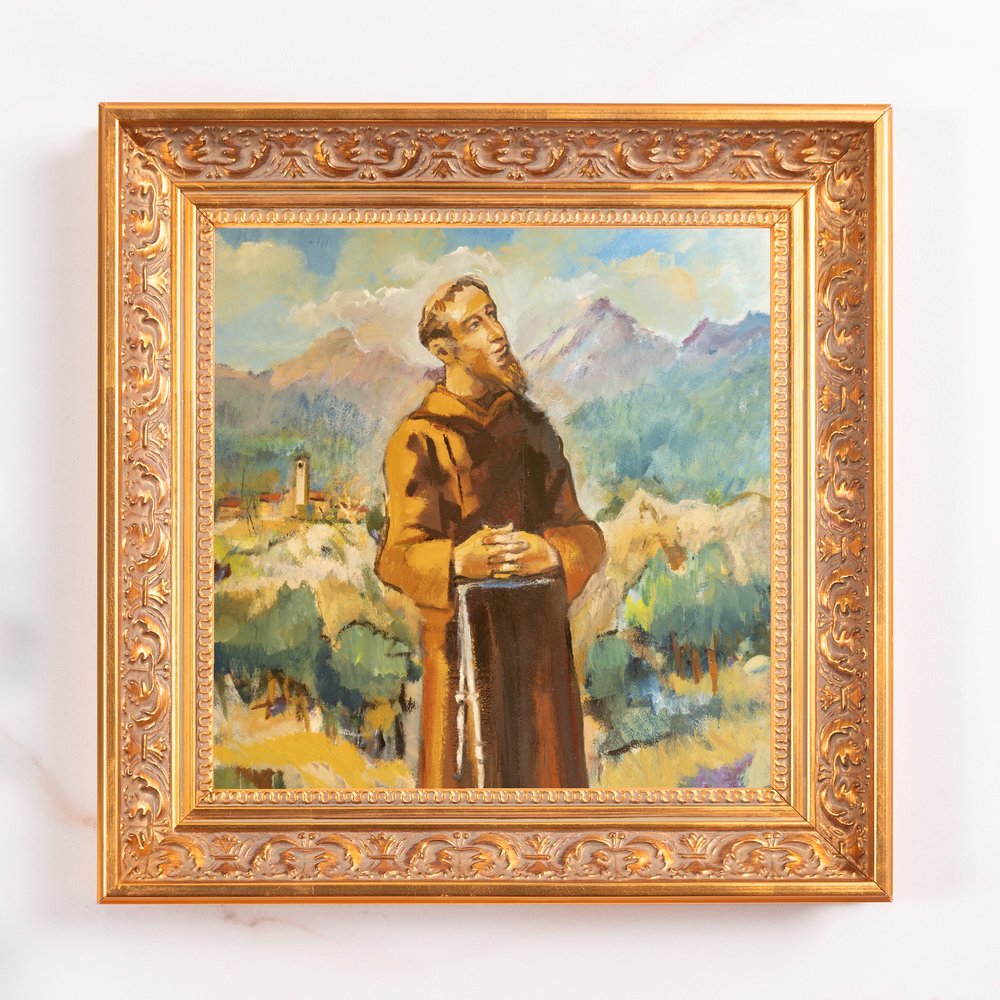 Framed oil painting of a friar in a brown robe, gazing upward in a landscape, gold ornate frame.