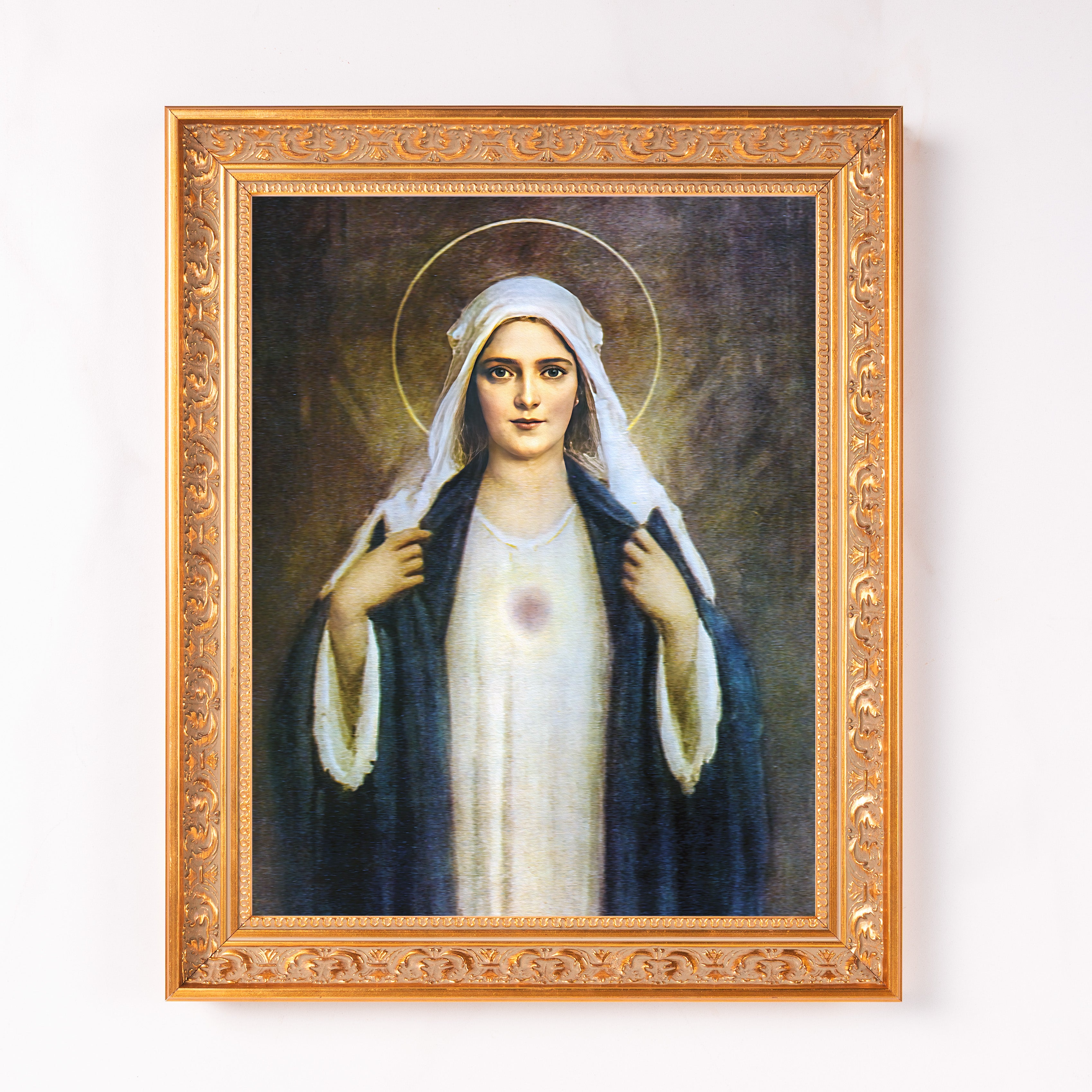 Framed, Old-fashioned print of the Virgin Mary in a gold ornate frame.