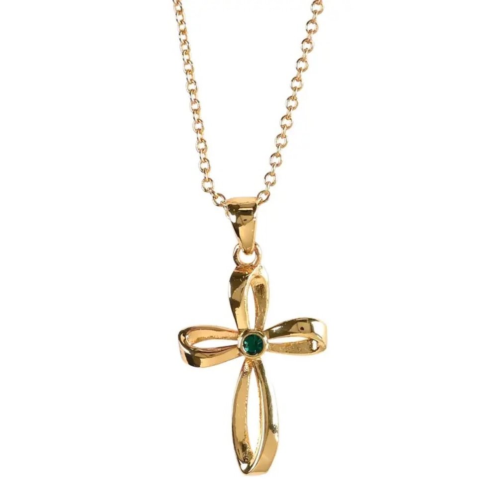 Gold necklace with a cross pendant, a green gemstone in the center, and ribbon accents.