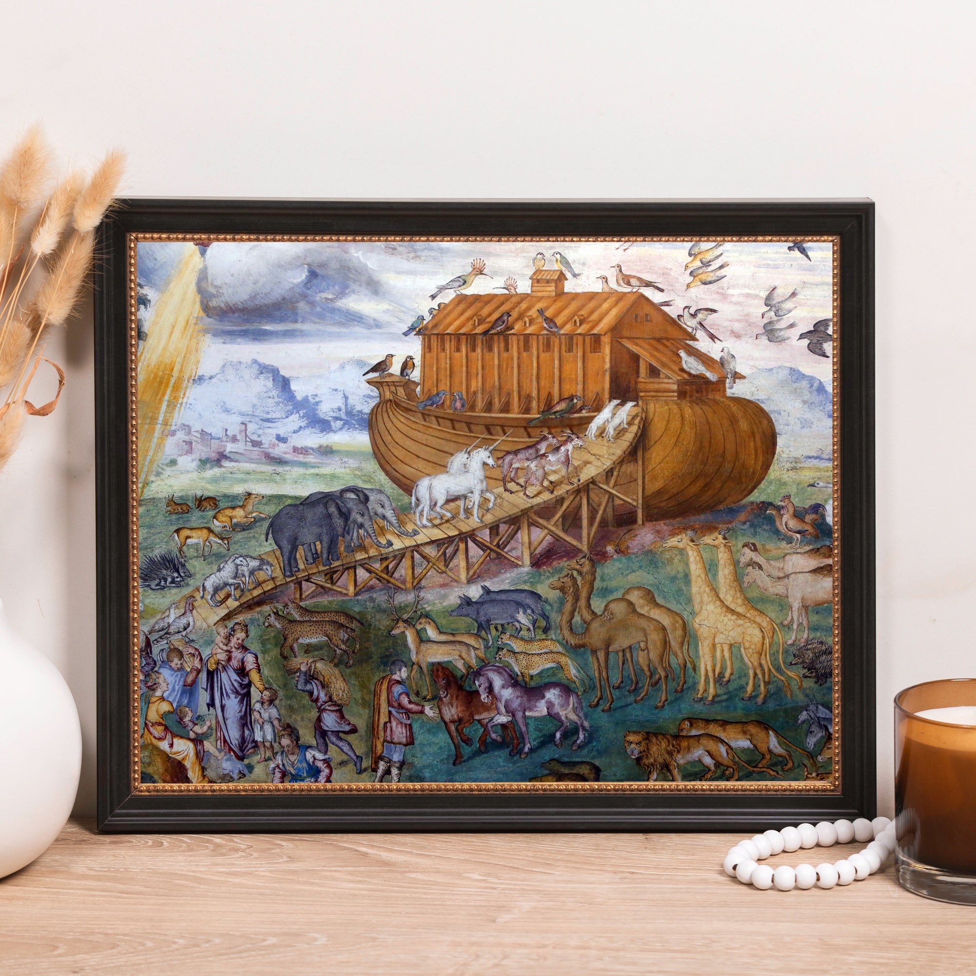 Framed print depicts Noah's Ark with animals boarding the wooden vessel, vintage style.
