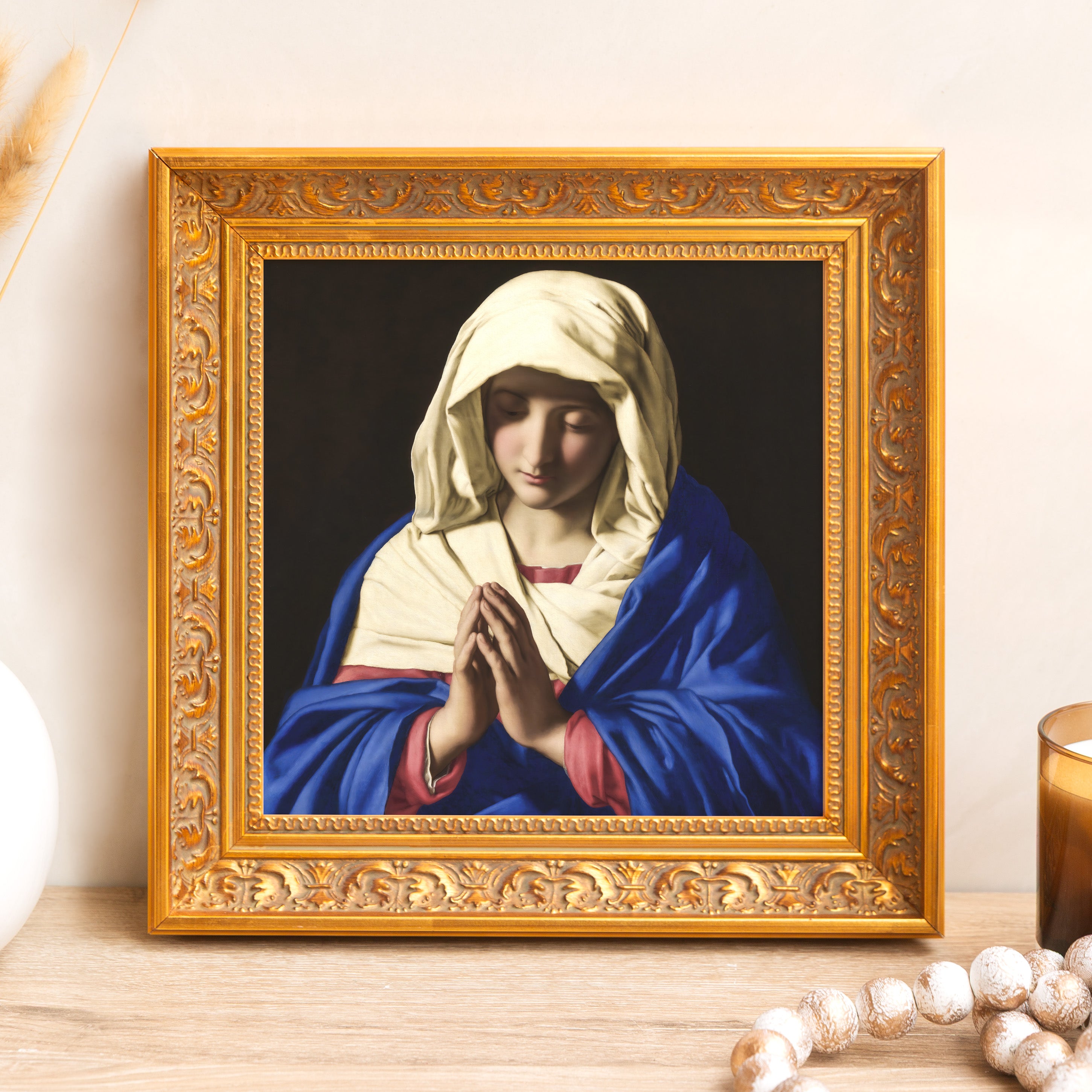 Framed art print of Mary in prayer, gold ornate frame.